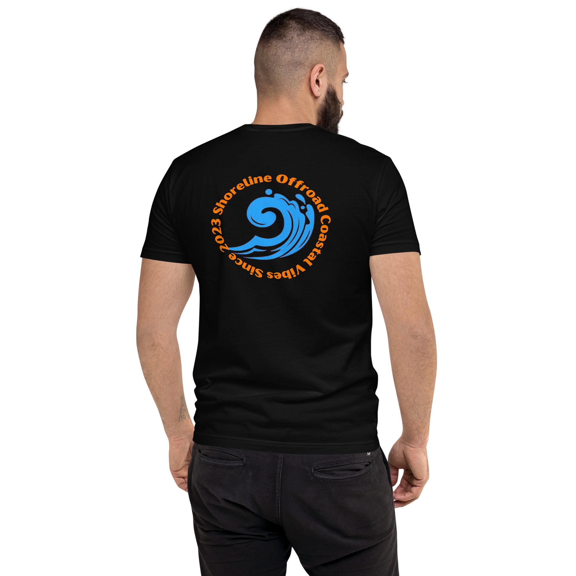 a man wearing a black shirt with a blue wave on it