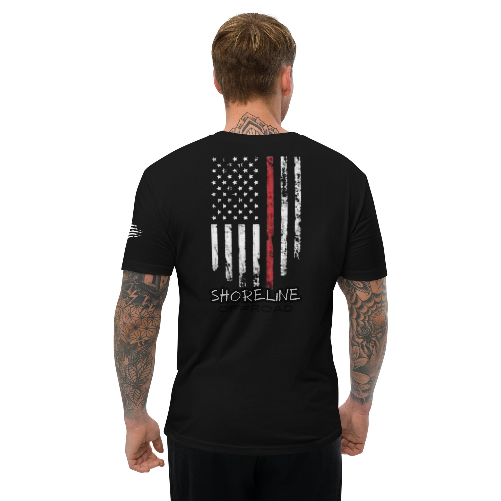 a man wearing a black shirt with the american flag on it