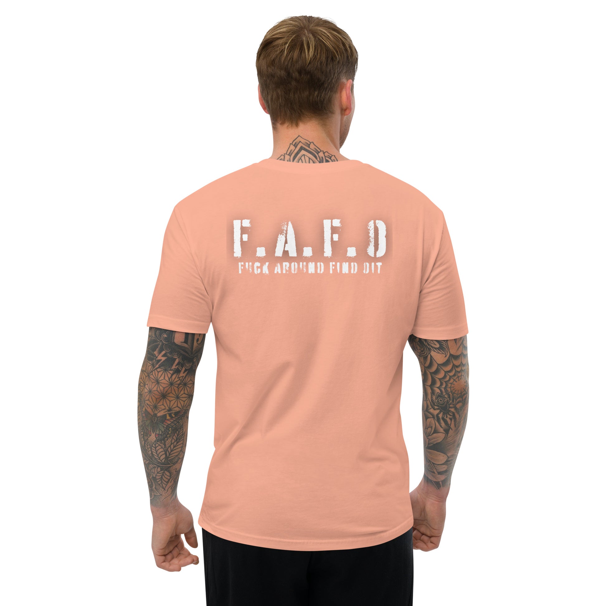 a man wearing a pink t - shirt with the words f a f d on