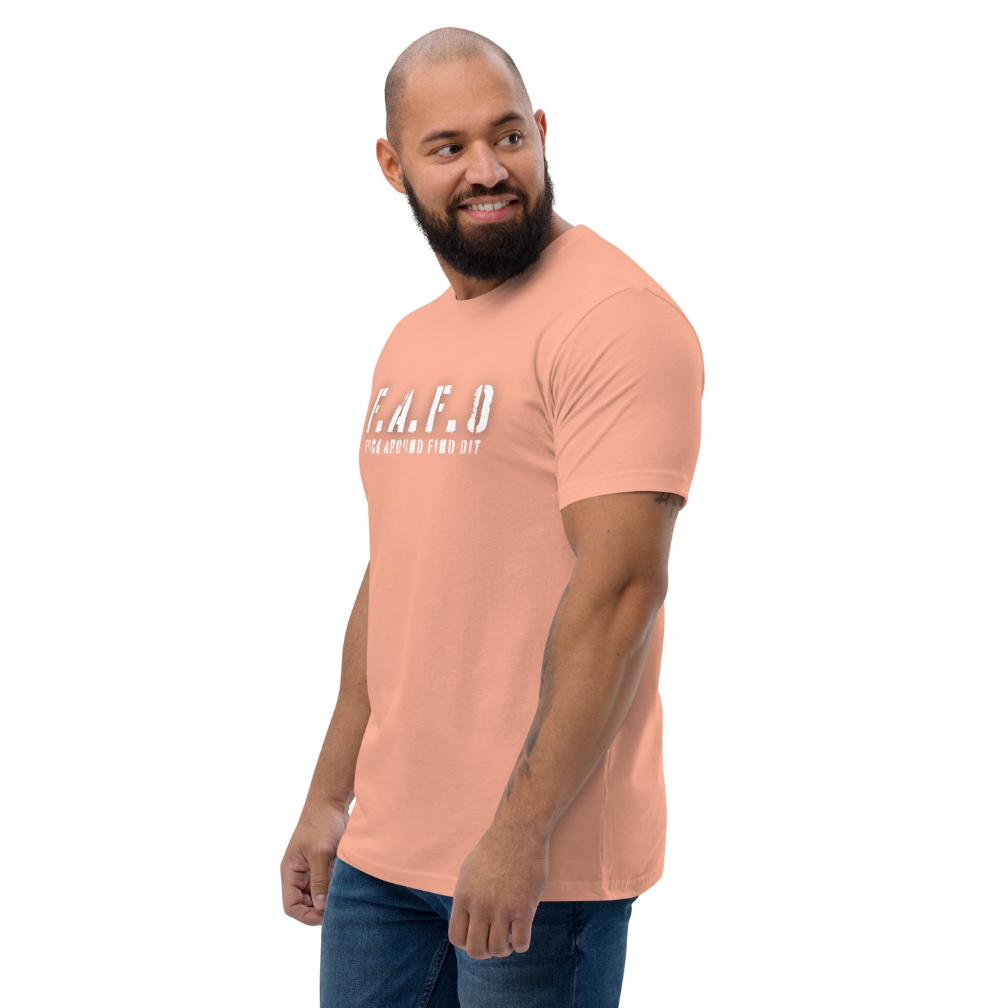 a man with a beard wearing a pink shirt