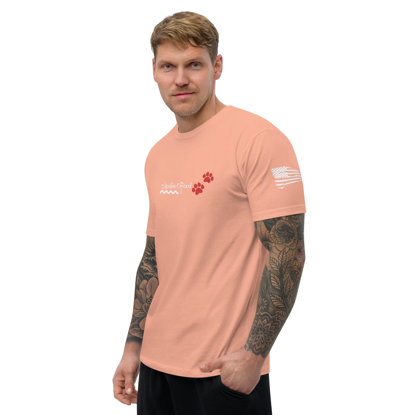 a man with a tattoo on his arm wearing a pink shirt