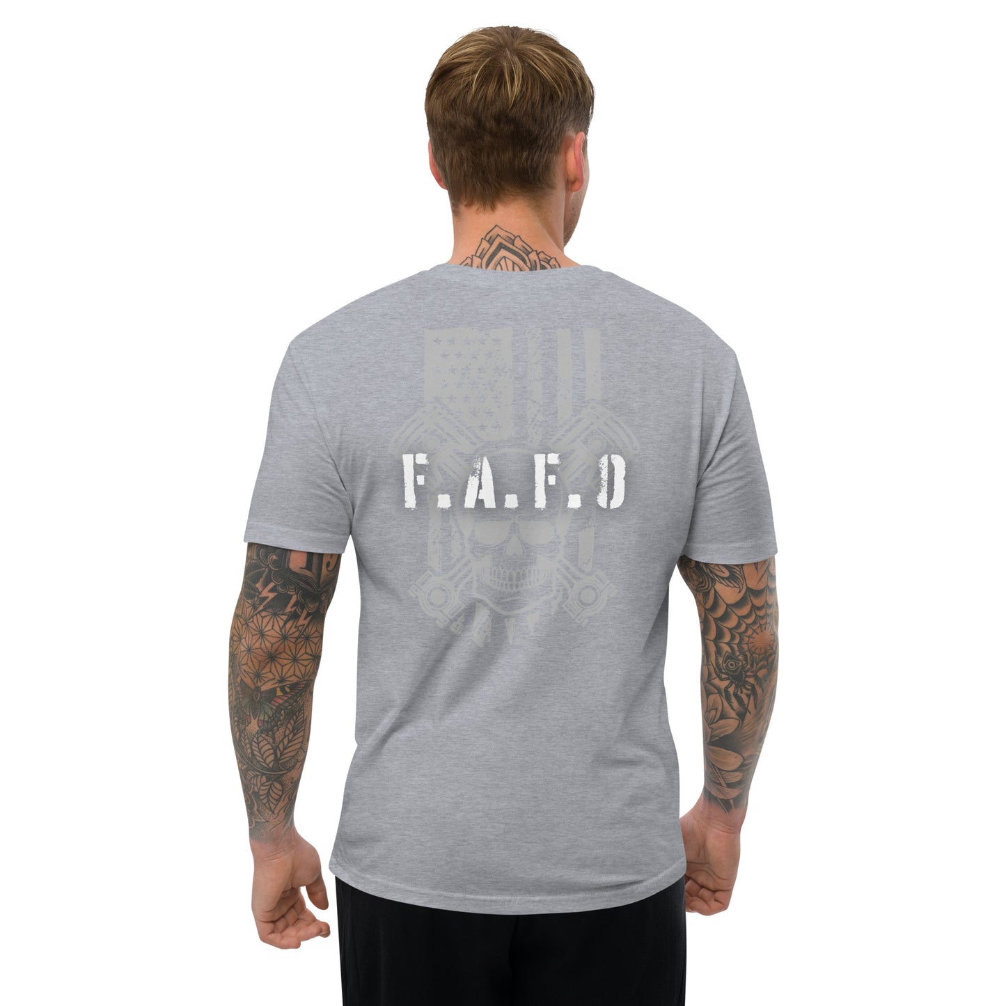 a man wearing a grey t - shirt with the word e a d printed on