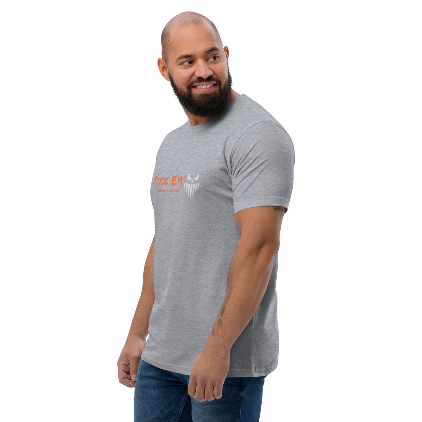 a man with a beard wearing a grey shirt