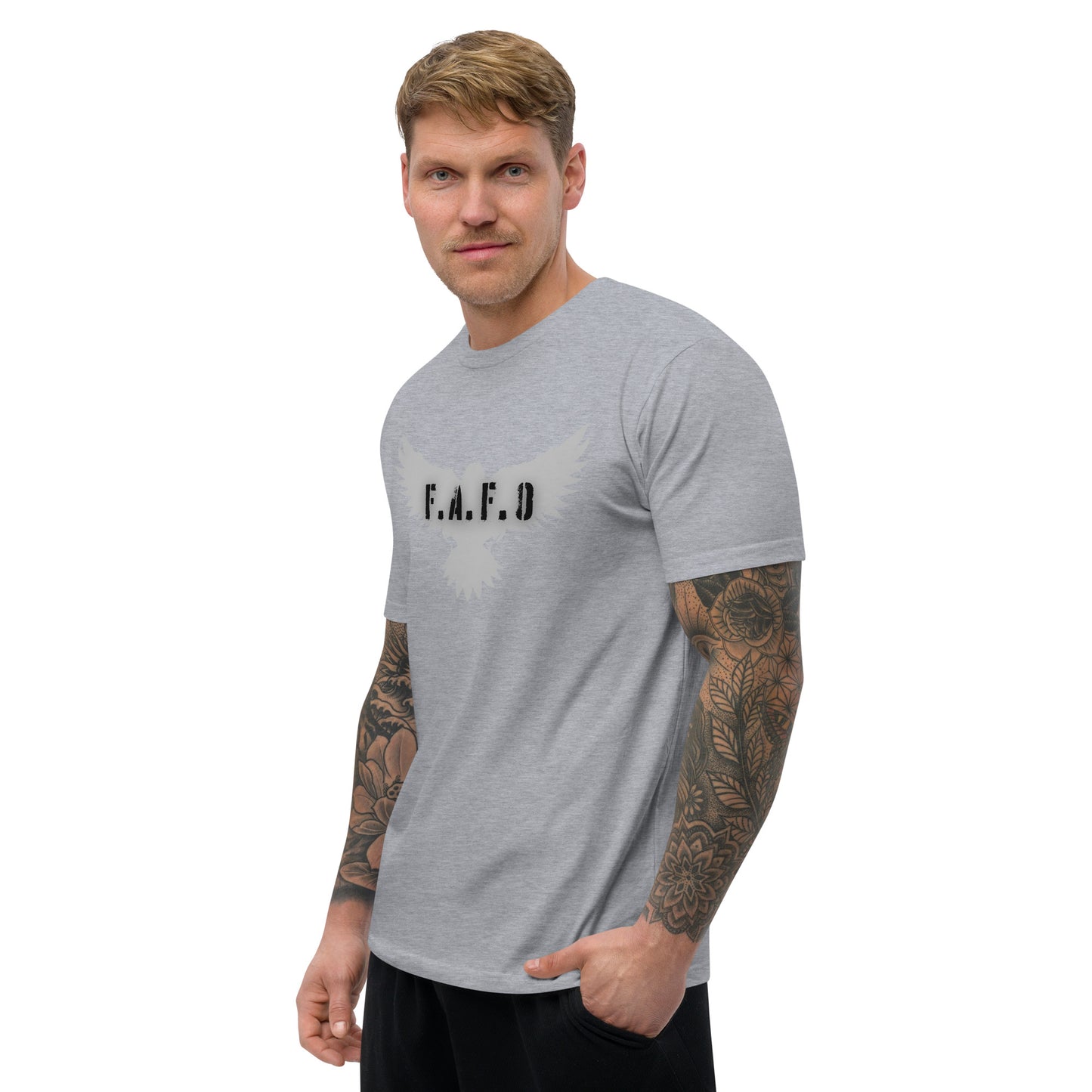 a man with a tattooed arm wearing a grey t - shirt