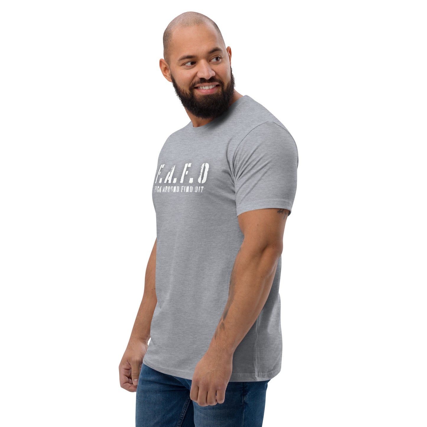 a man with a beard wearing a grey t - shirt