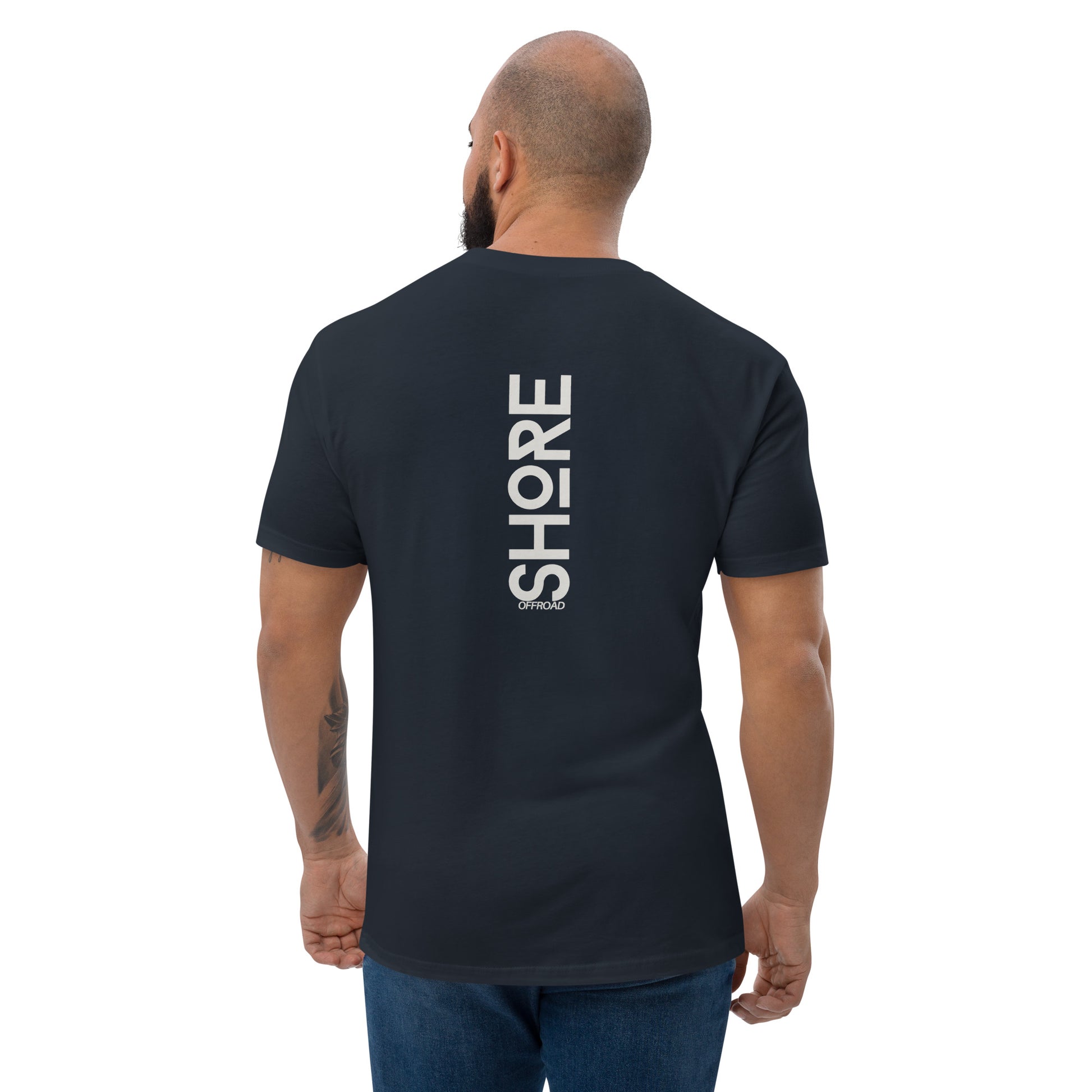 a man wearing a black shirt with the words store on it