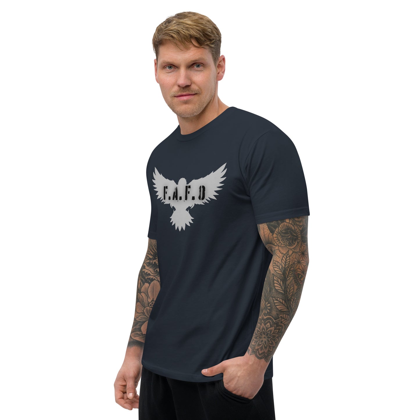 a man with a tattooed arm wearing a t - shirt