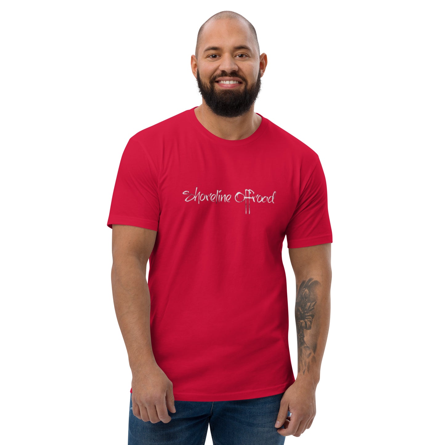 a man with a beard wearing a red shirt