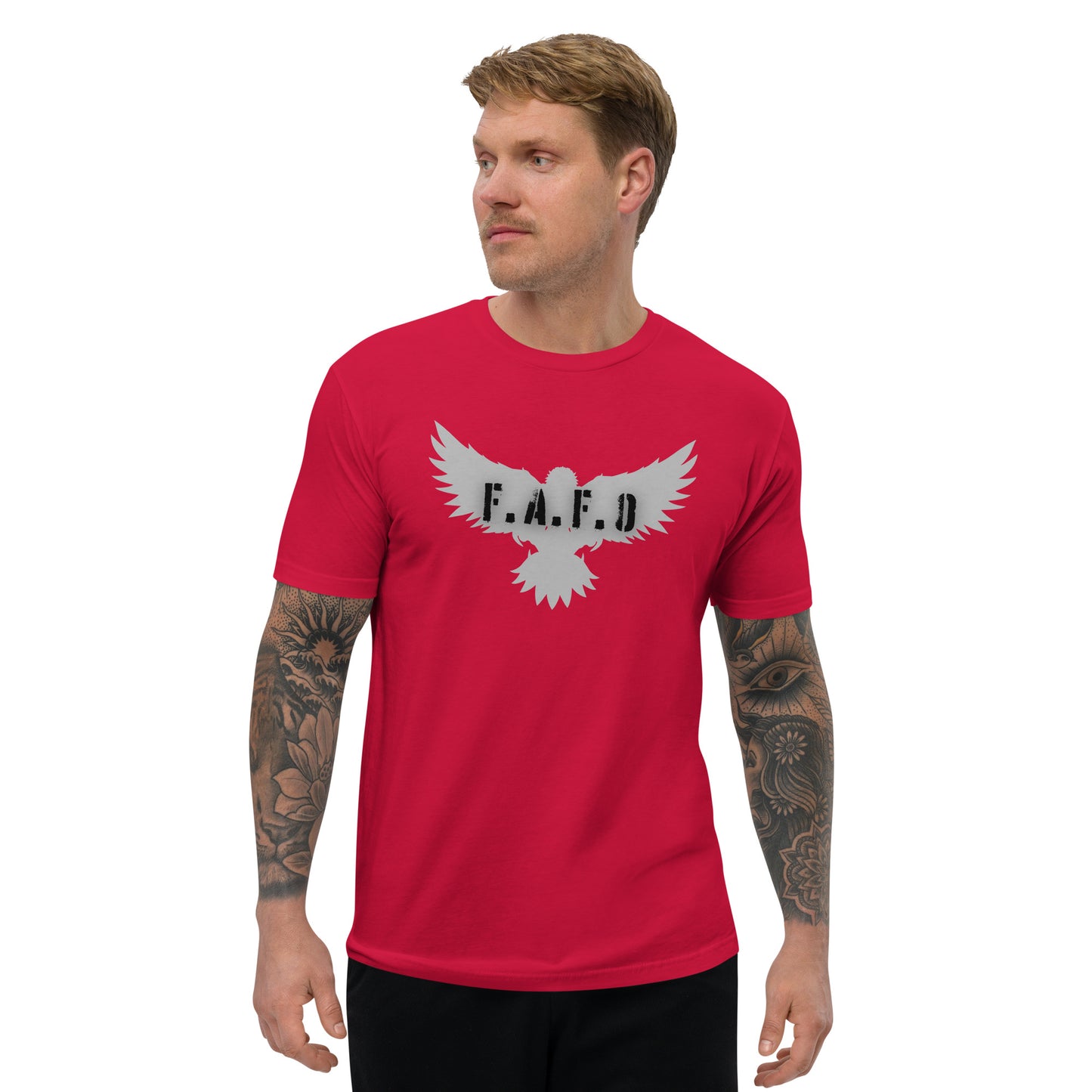 a man wearing a red t - shirt with a white eagle on it