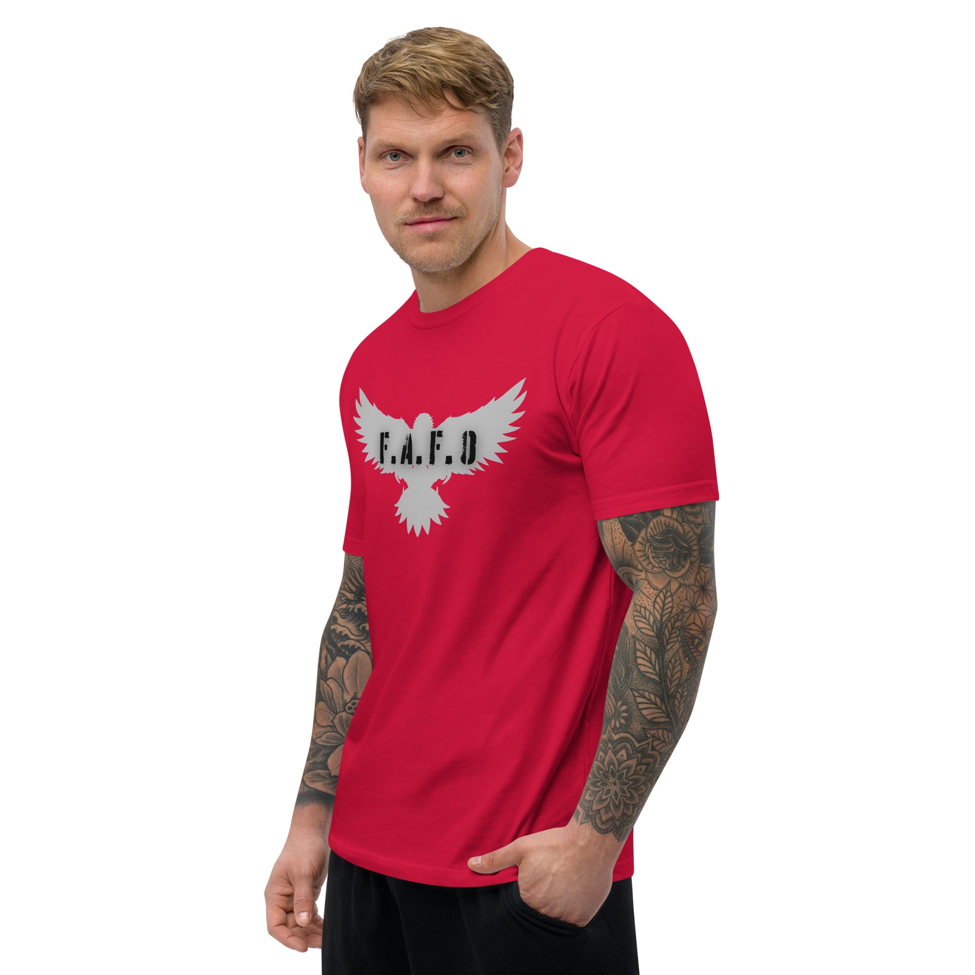 a man wearing a red t - shirt with an eagle on it