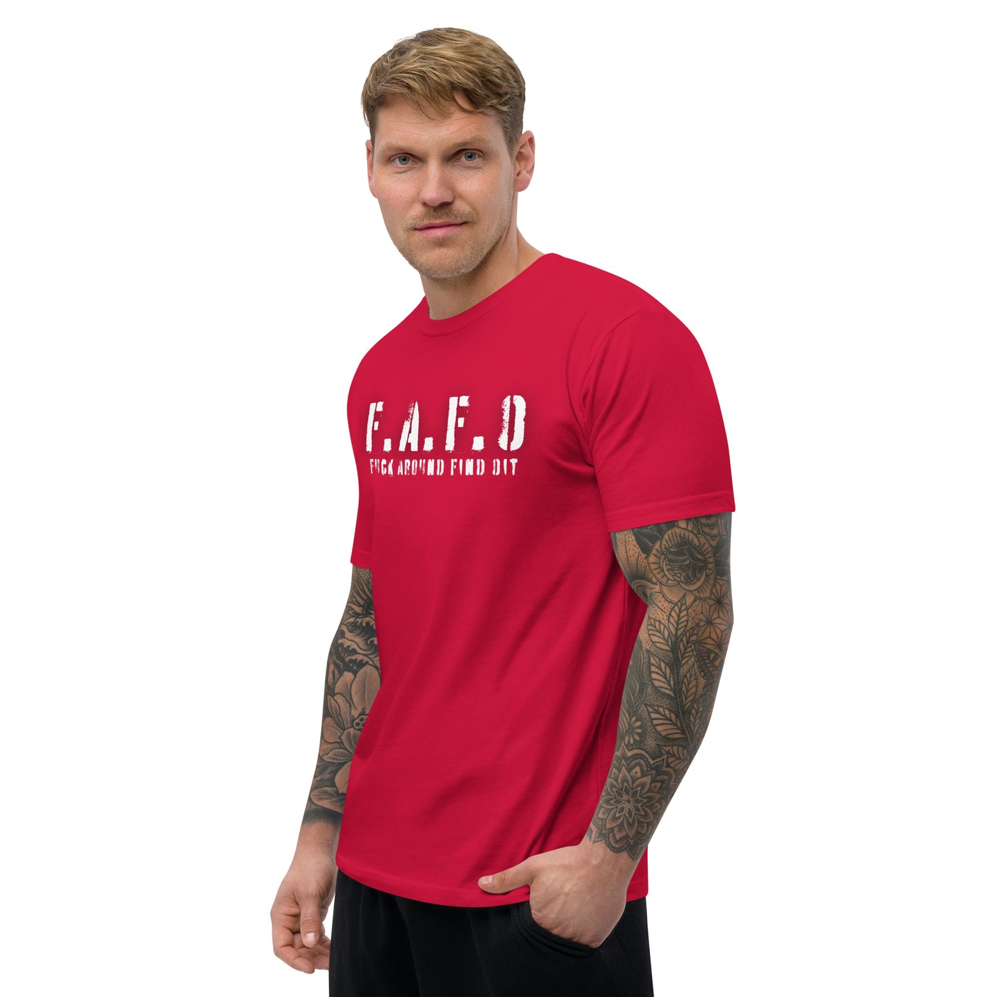 a man with a tattooed arm wearing a red t - shirt