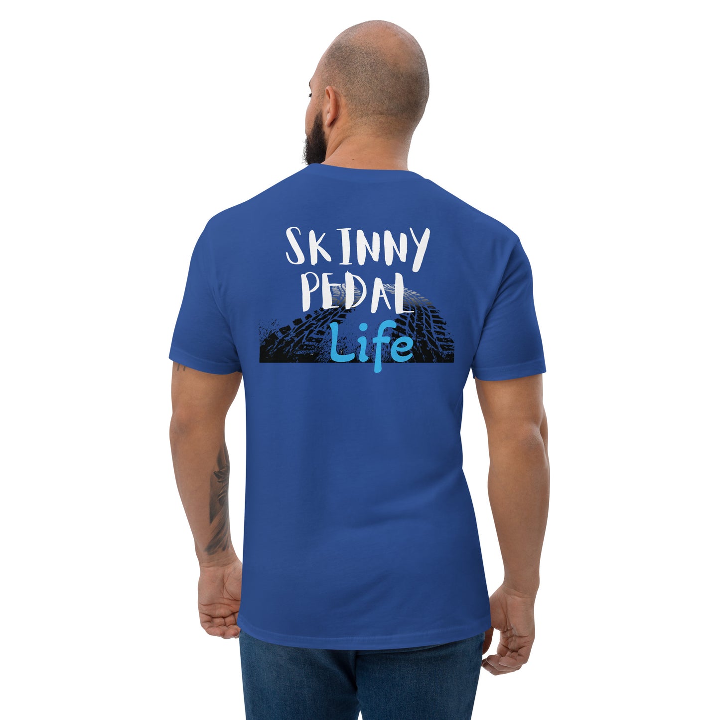 a man wearing a blue shirt that says skiinny pedal life