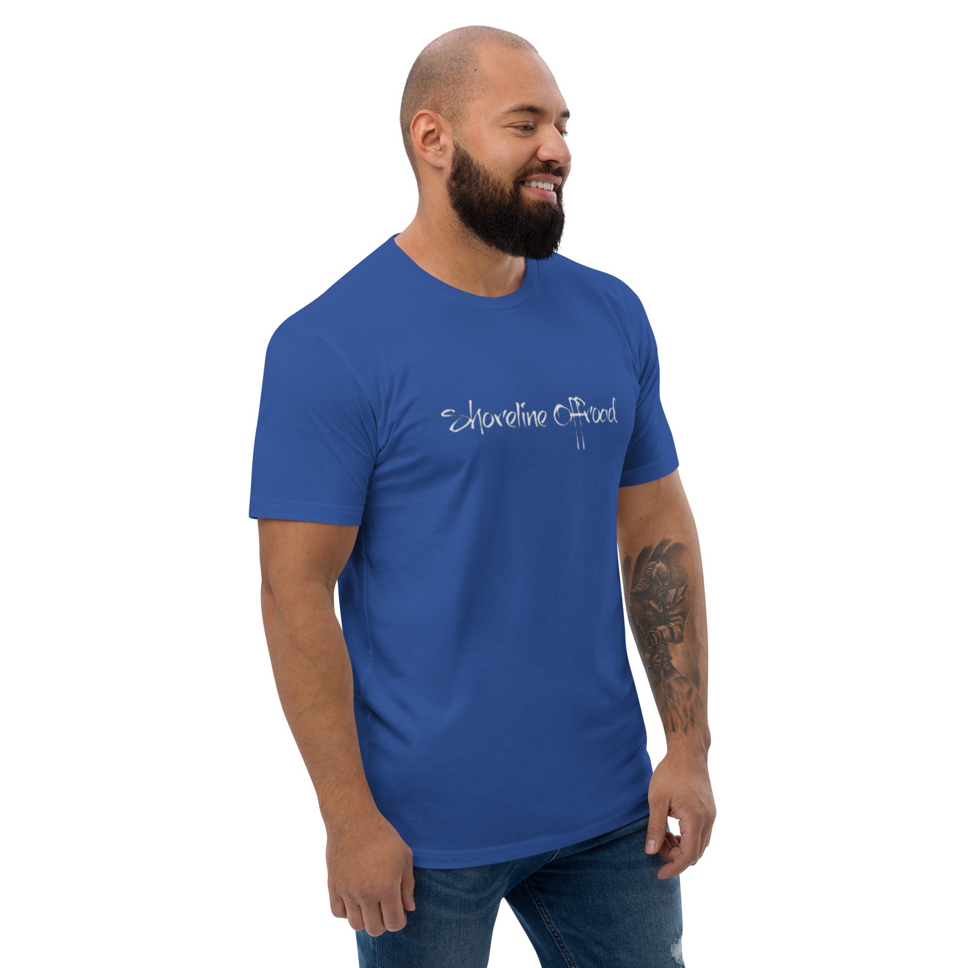 a man with a beard wearing a blue t - shirt