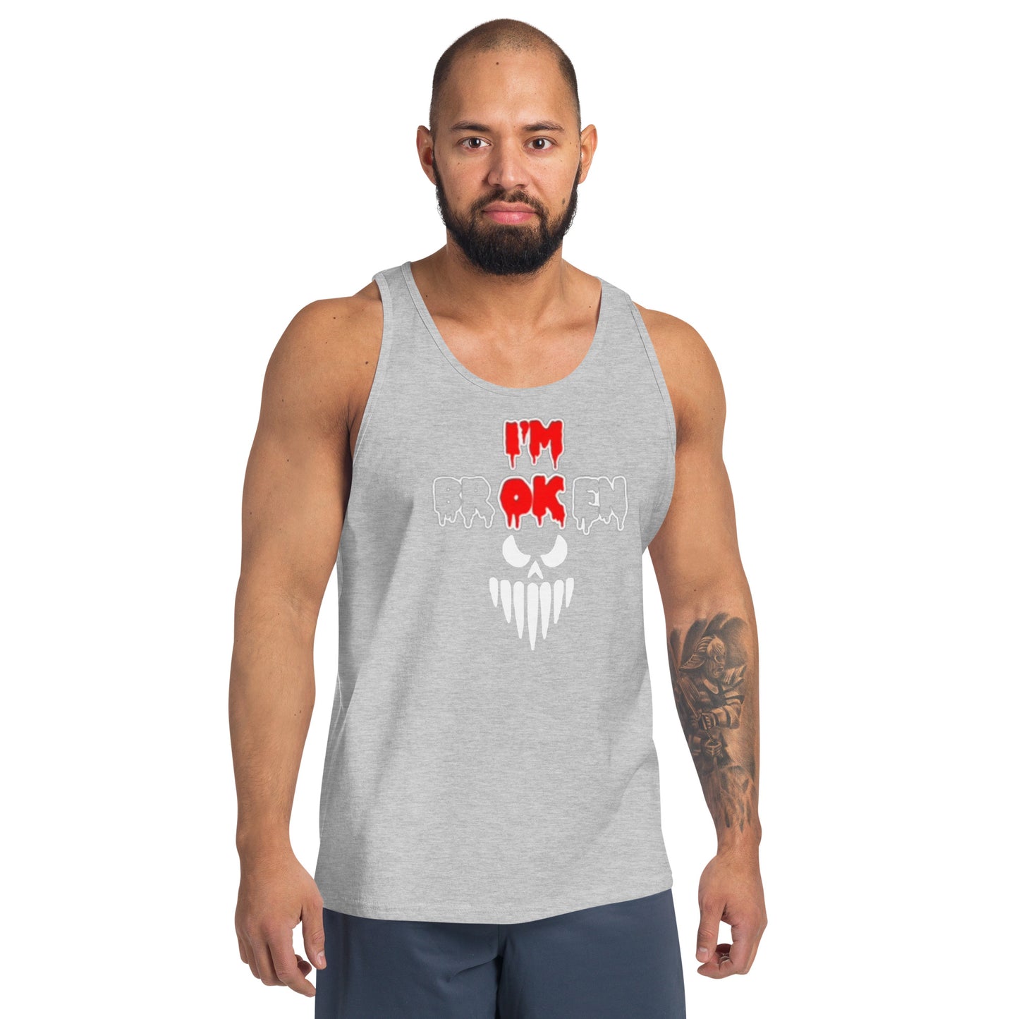 a man wearing a tank top with a skull on it