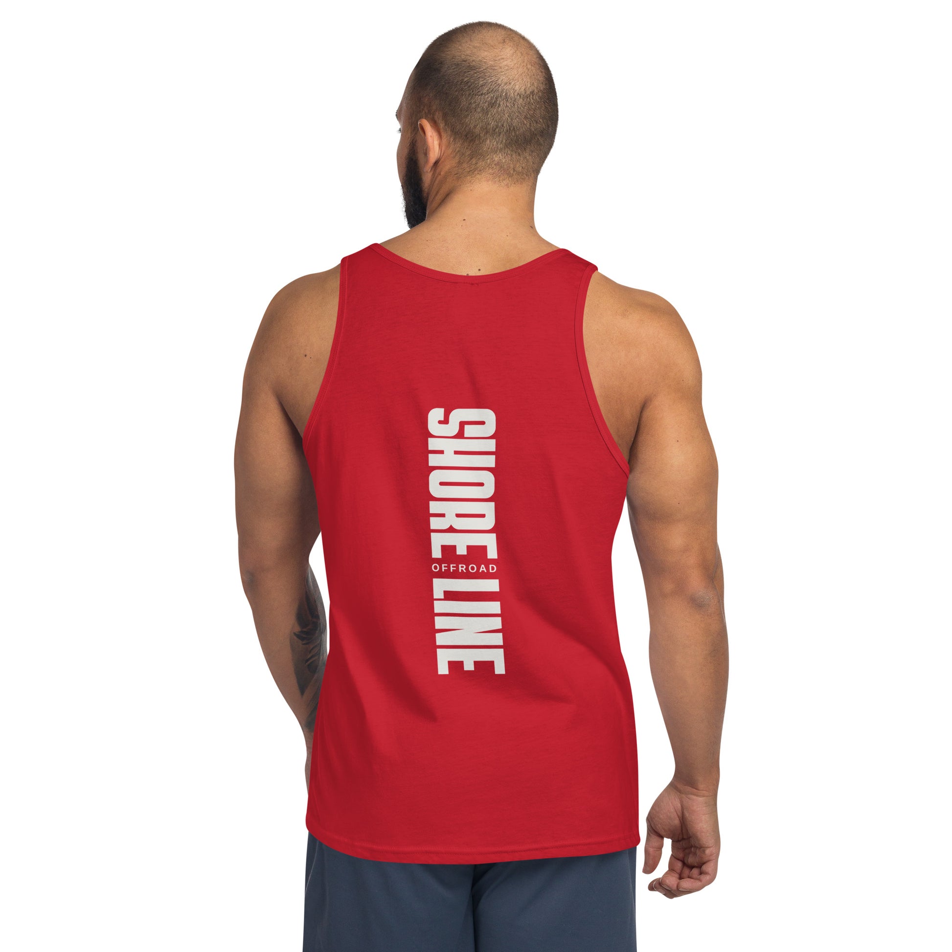 a man wearing a red tank top with white lettering