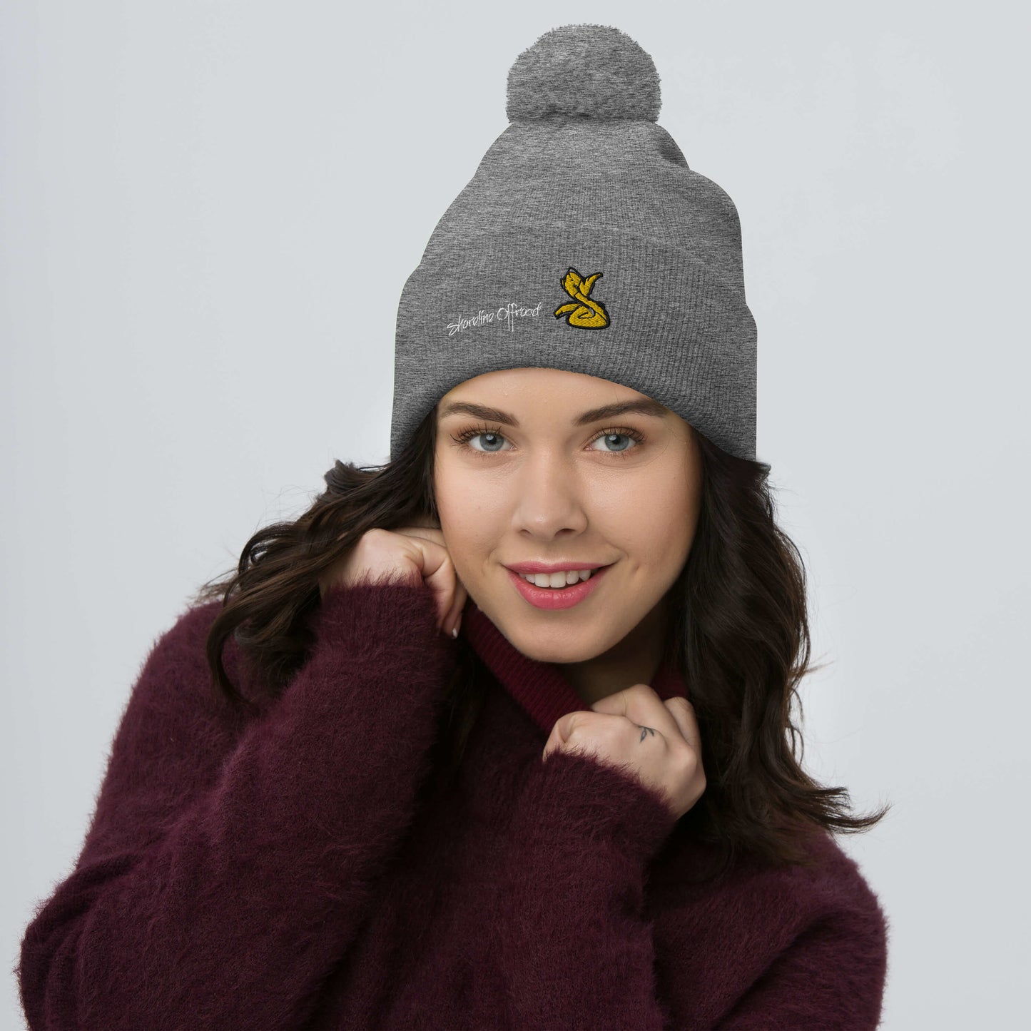 a woman wearing a beanie with a banana on it