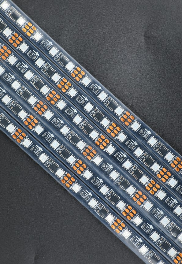 a close up of a strip of orange and white leds