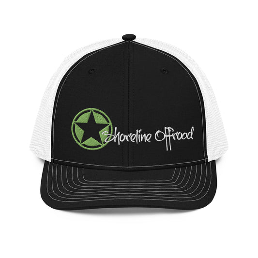 a black and white trucker hat with a green star on the front