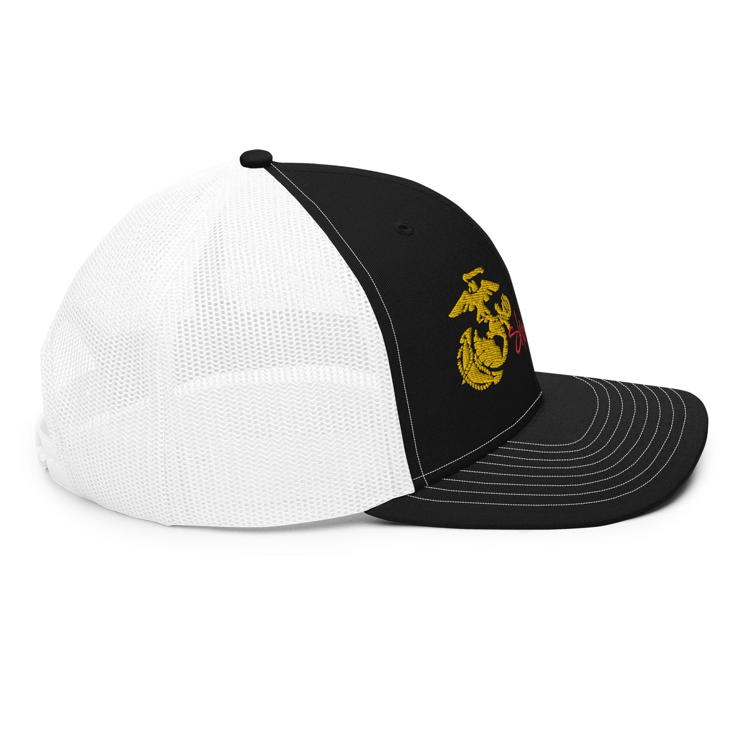 a black and white hat with a yellow emblem