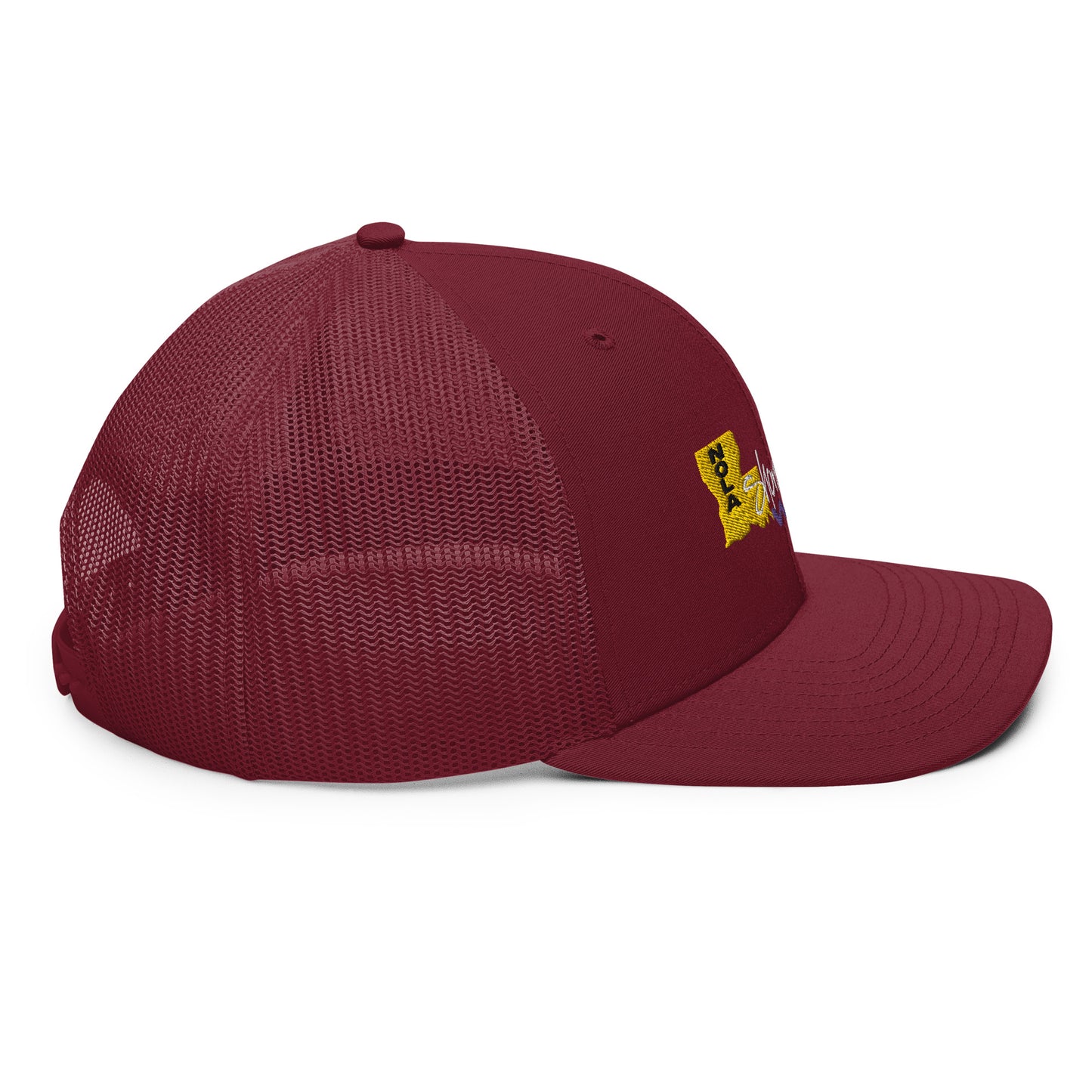 a maroon hat with a yellow patch on the front