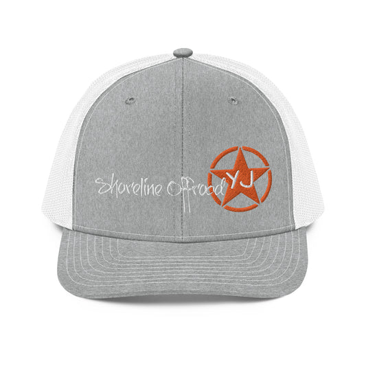 a grey and white trucker hat with an orange star on the front