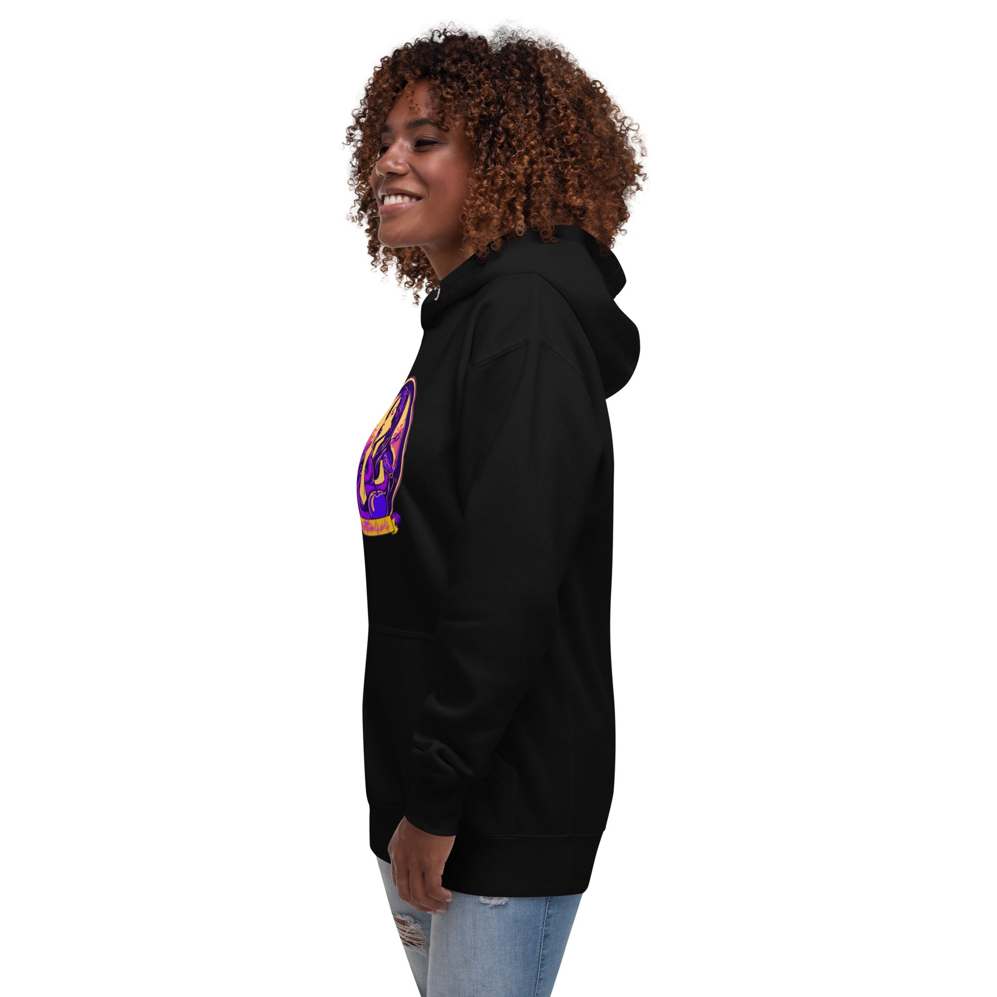 a woman with curly hair wearing a black hoodie