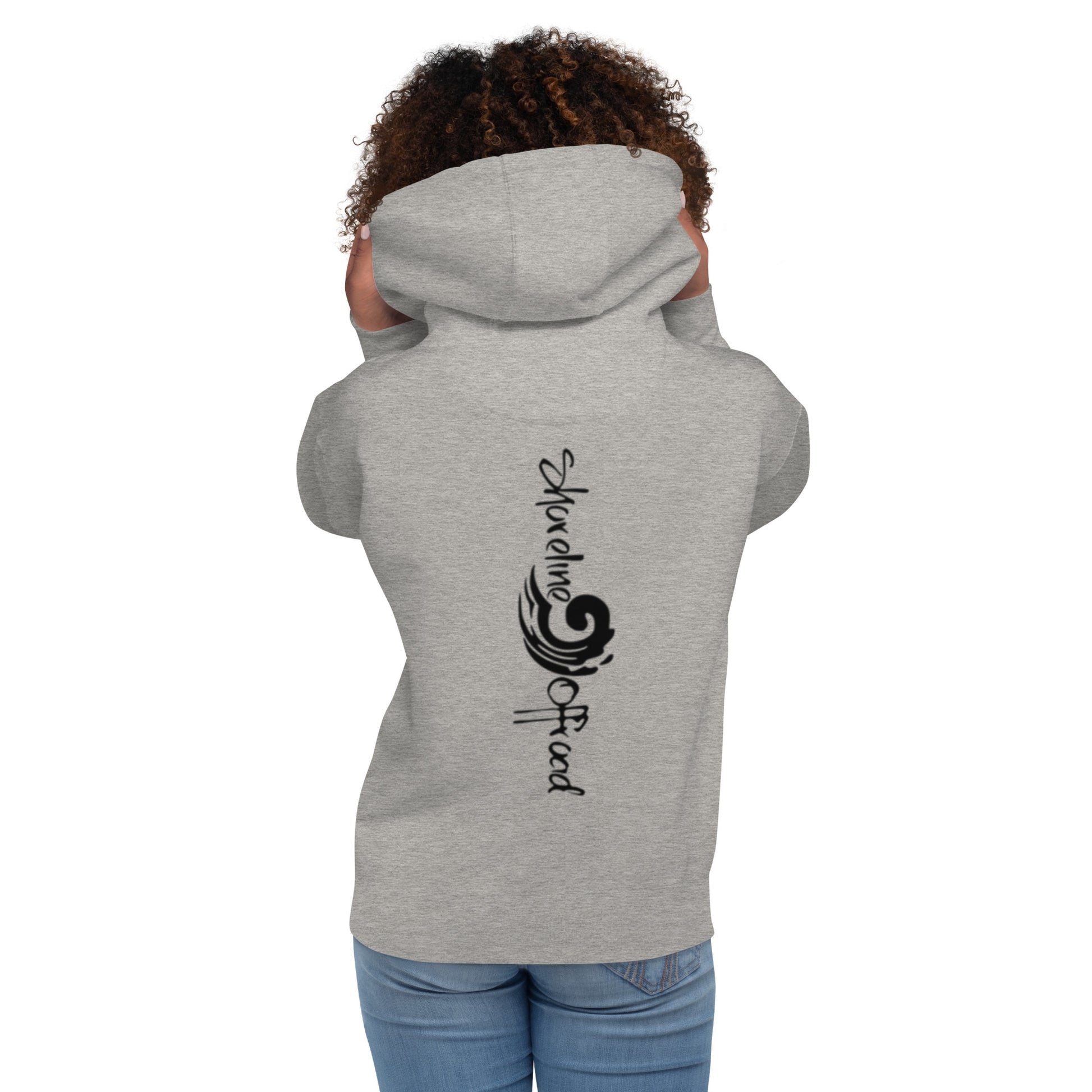 a woman wearing a grey hoodie with a black design on it