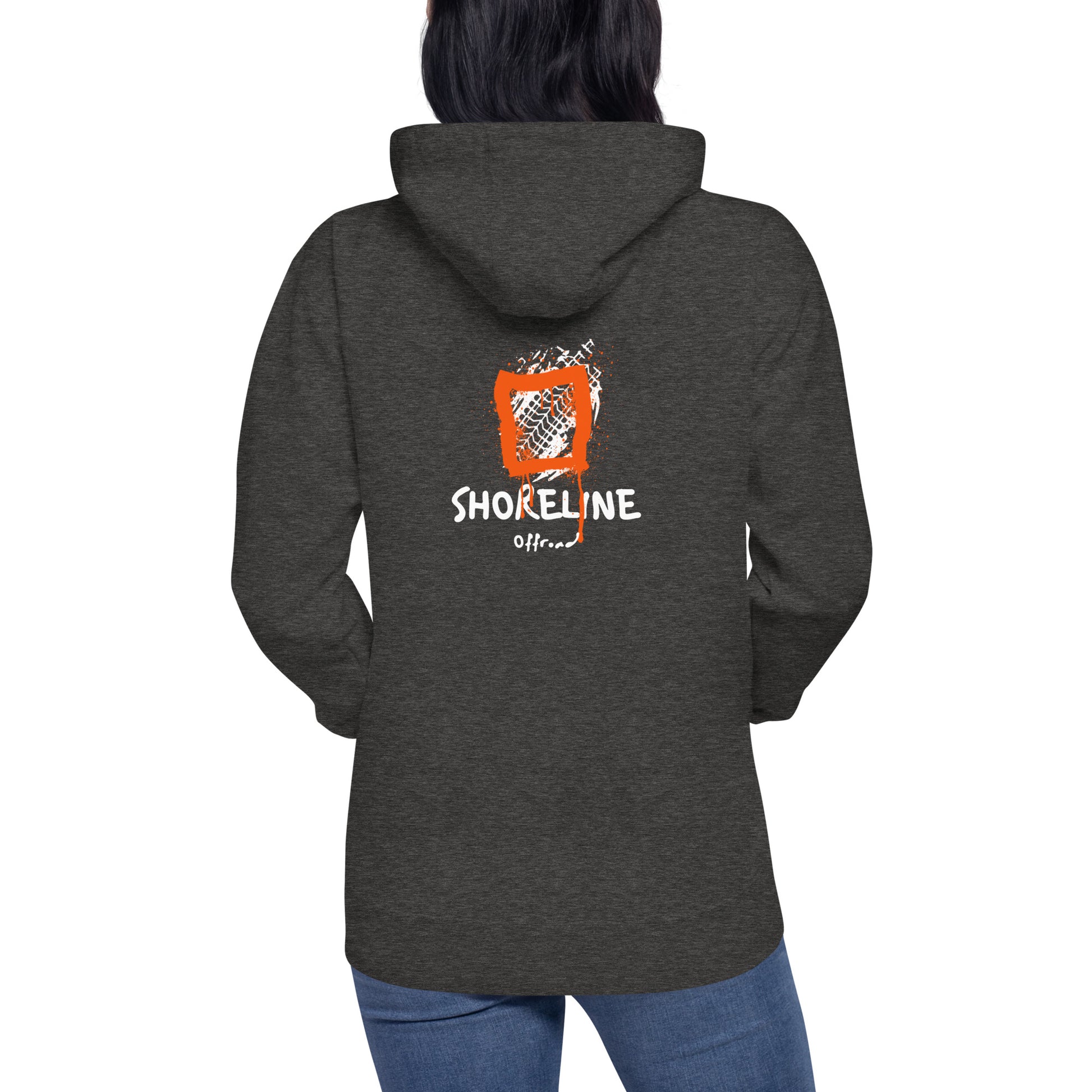 a woman wearing a hoodie with the words shoreline on it