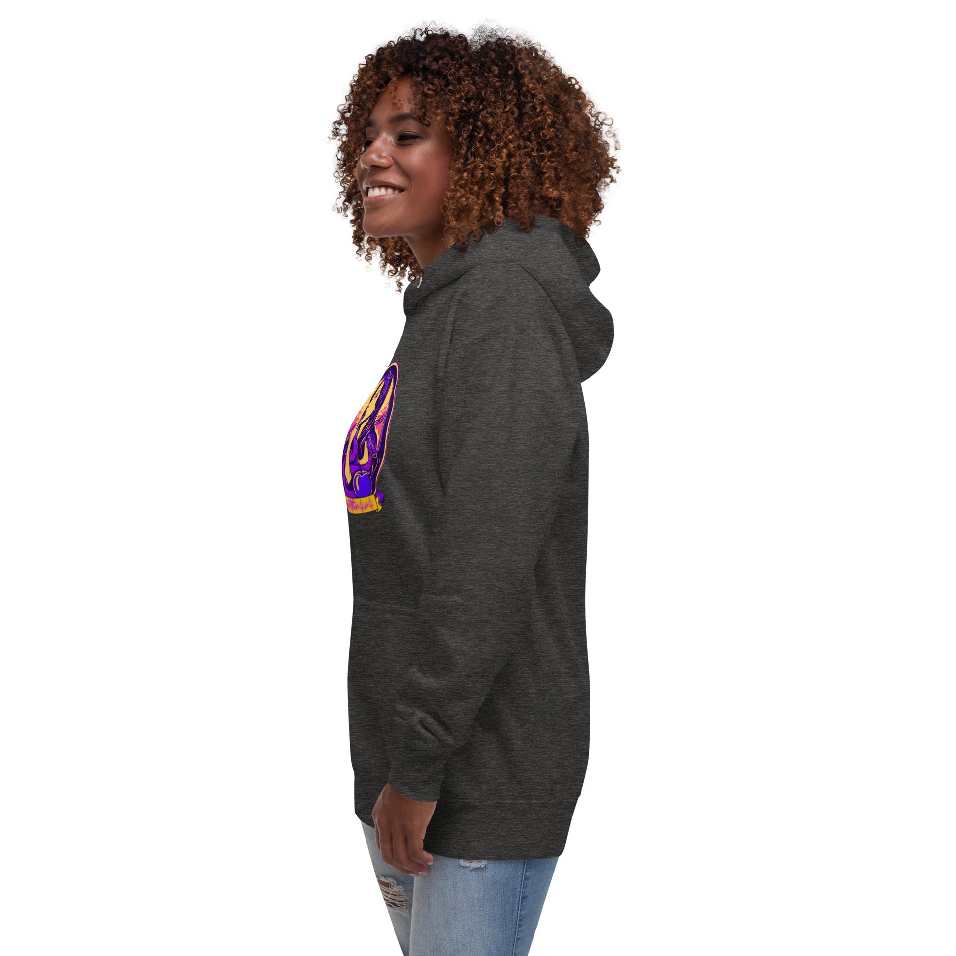 a woman wearing a black hoodie with a purple and yellow design on it