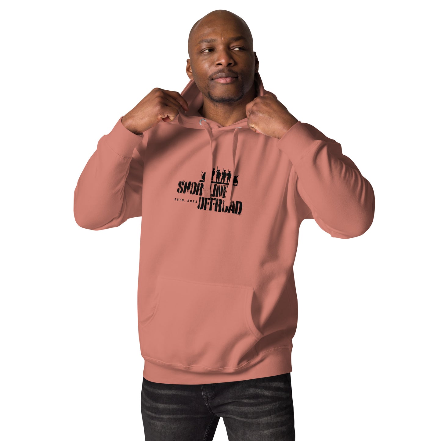 a man wearing a pink hoodie with a black print on it