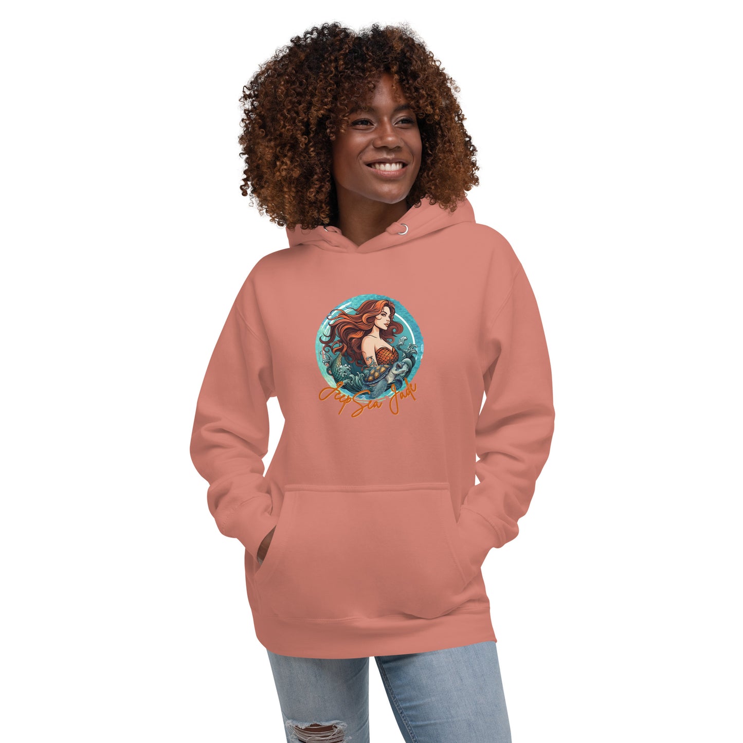 a woman wearing a pink hoodie with a picture of a mermaid on it