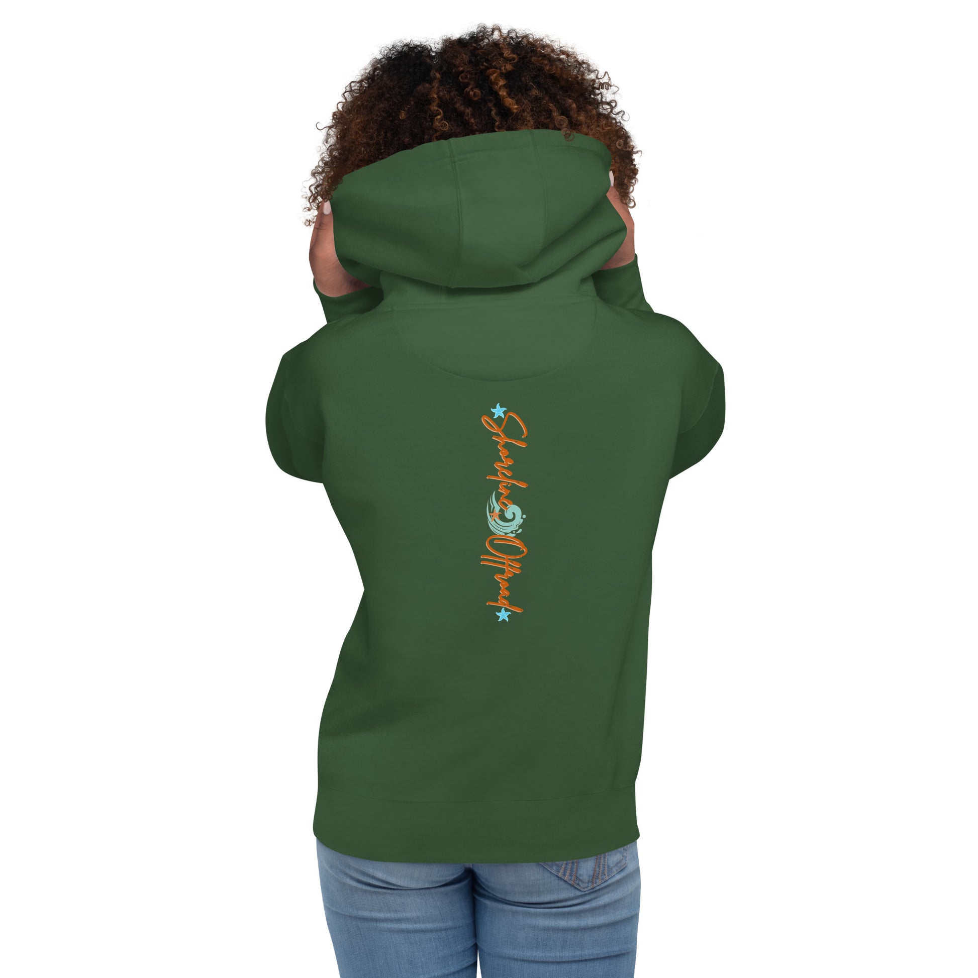 a woman wearing a green hoodie with an orange and blue design on it