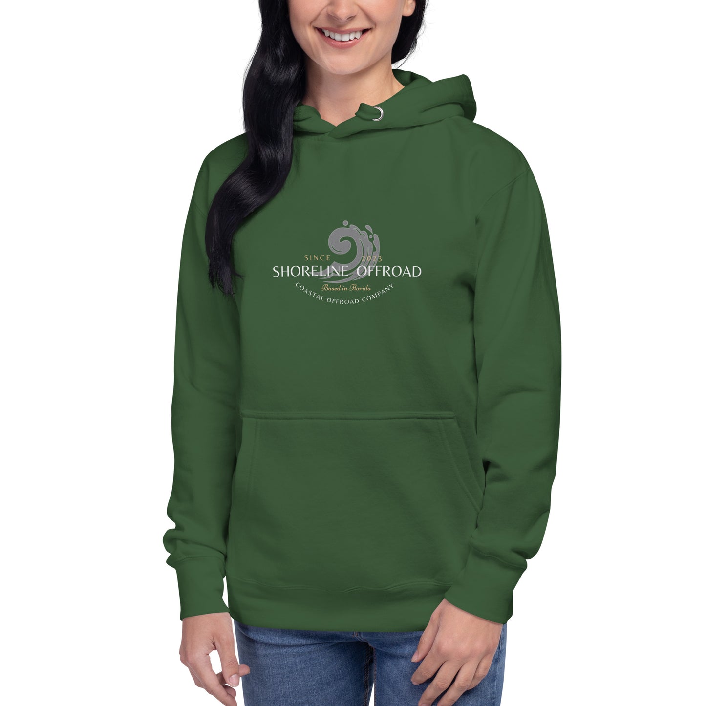 a woman wearing a green hoodie with the logo of the shophelp of