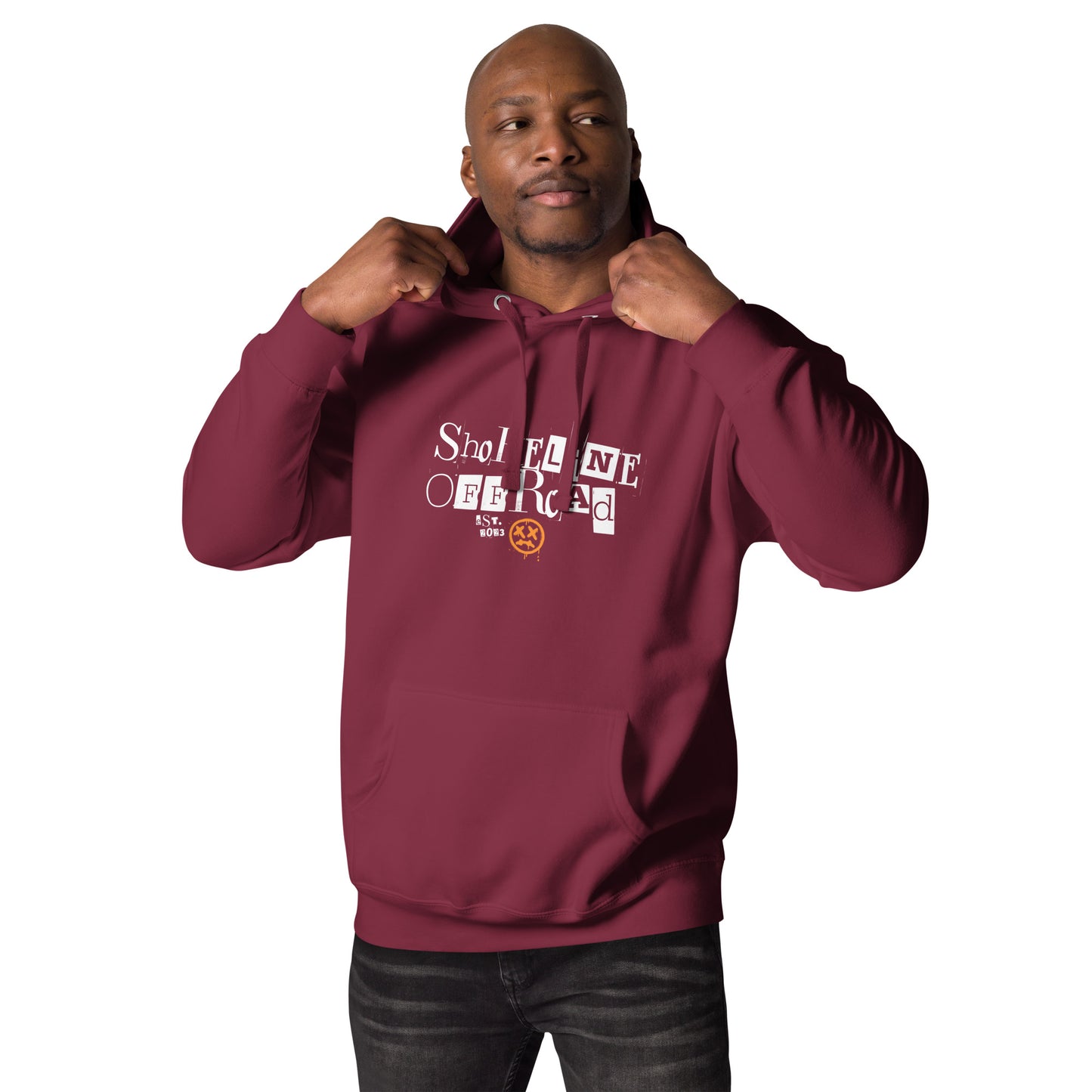 a man in a maroon hoodie poses for a picture