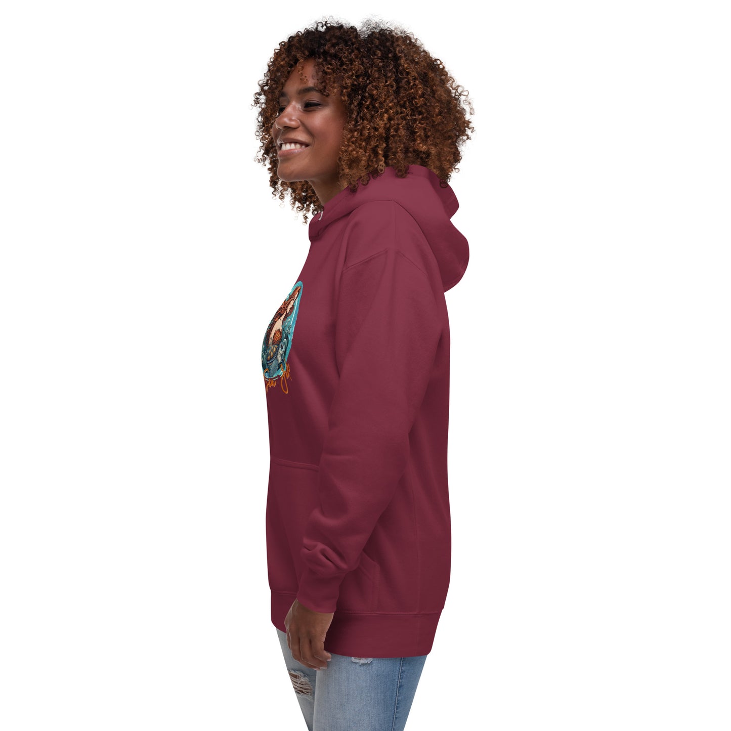 a woman wearing a maroon sweatshirt and jeans