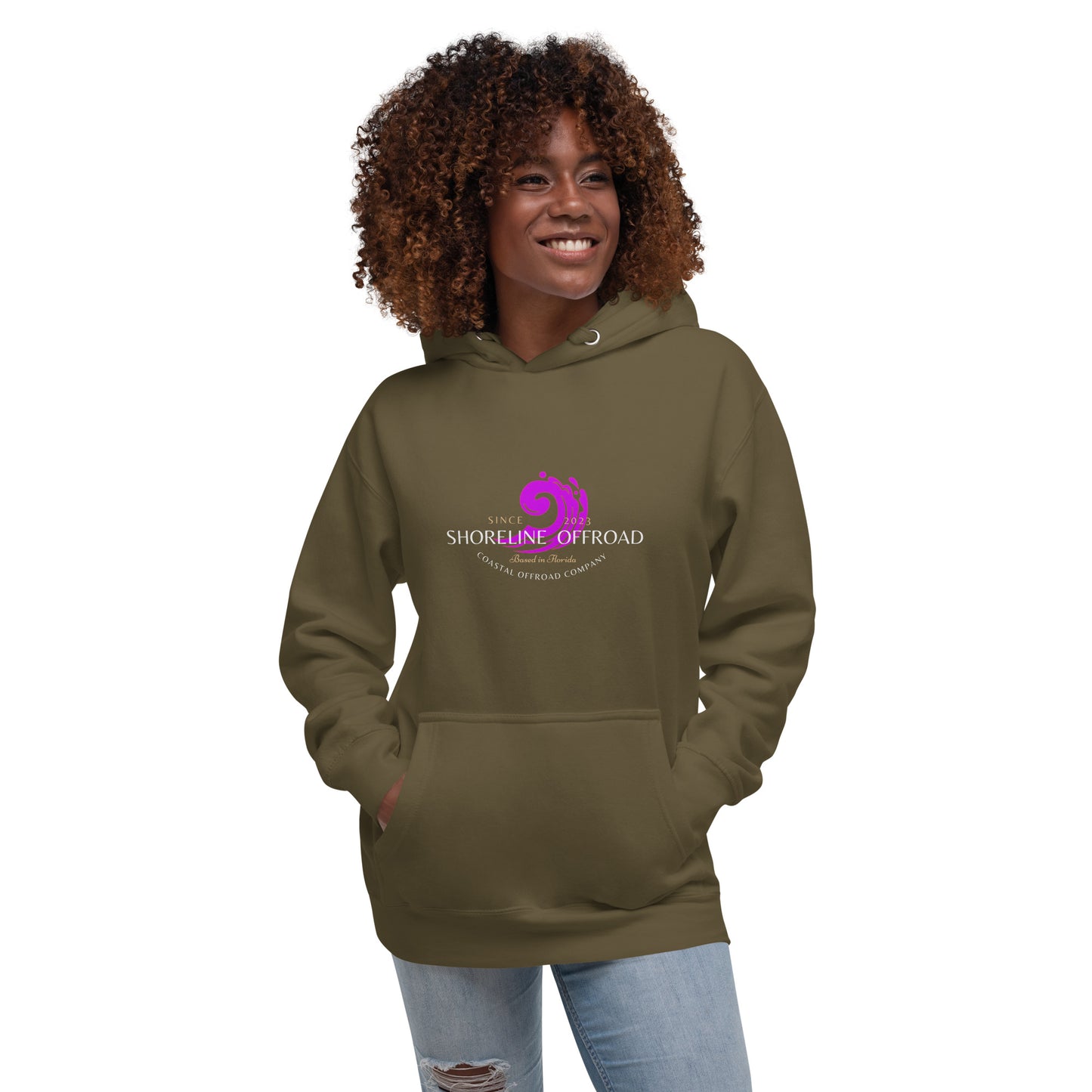 a woman wearing a brown hoodie with a pink logo