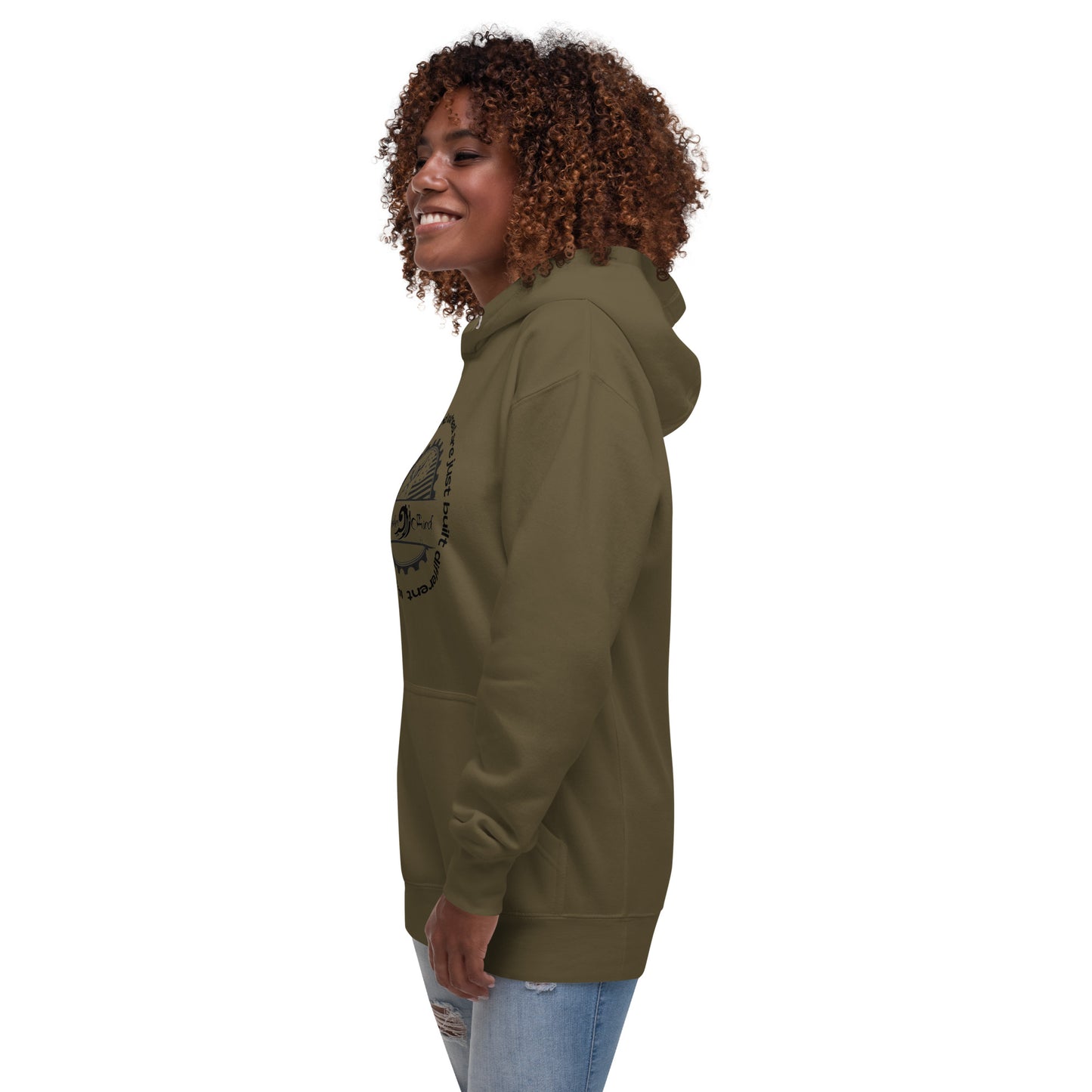 a woman with curly hair wearing a green hoodie