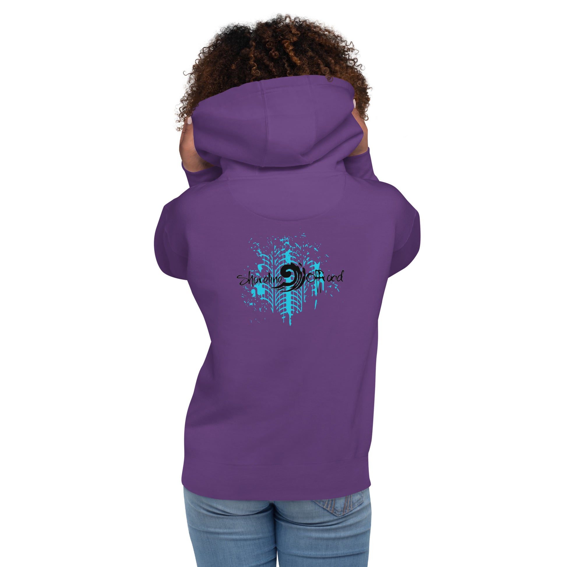 a woman wearing a purple hoodie with a blue design on it