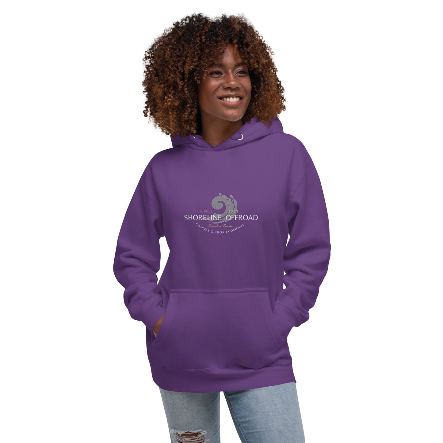 a woman wearing a purple hoodie with the logo of the women's organization