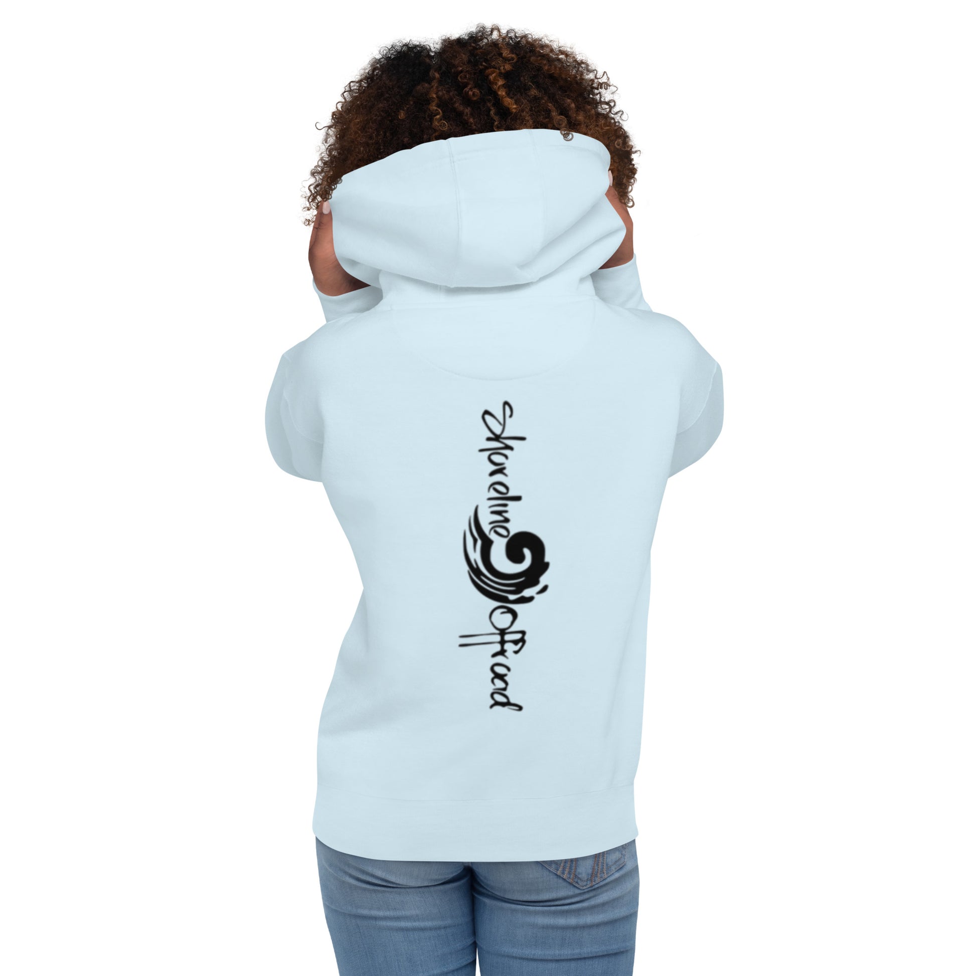 a woman wearing a white hoodie with a black design on it