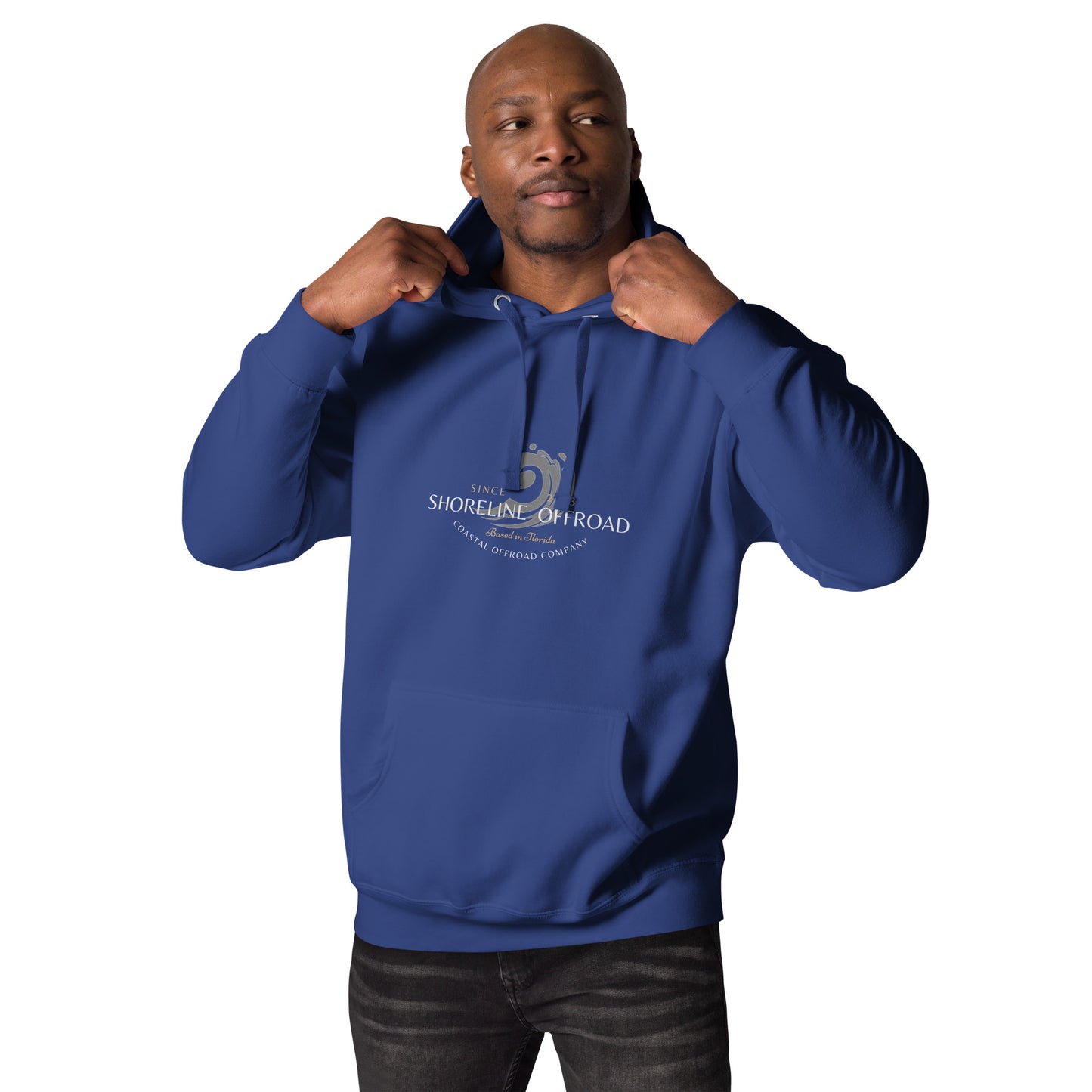 a man in a blue hoodie poses for a picture