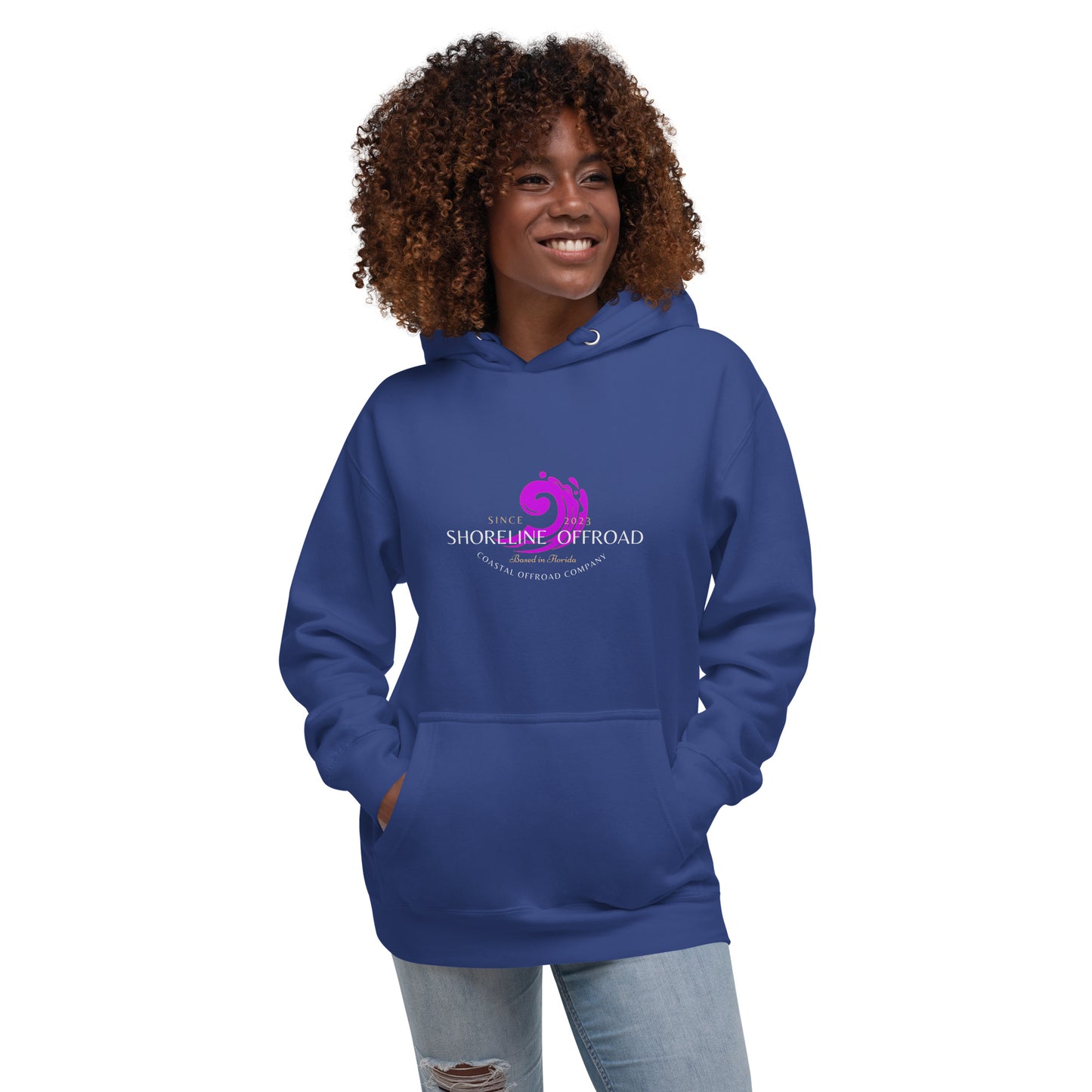 a woman wearing a blue hoodie with a pink logo