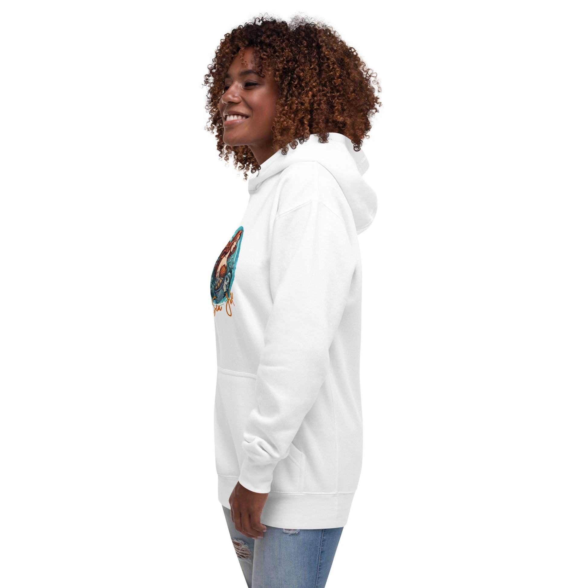 a woman wearing a white sweatshirt and jeans