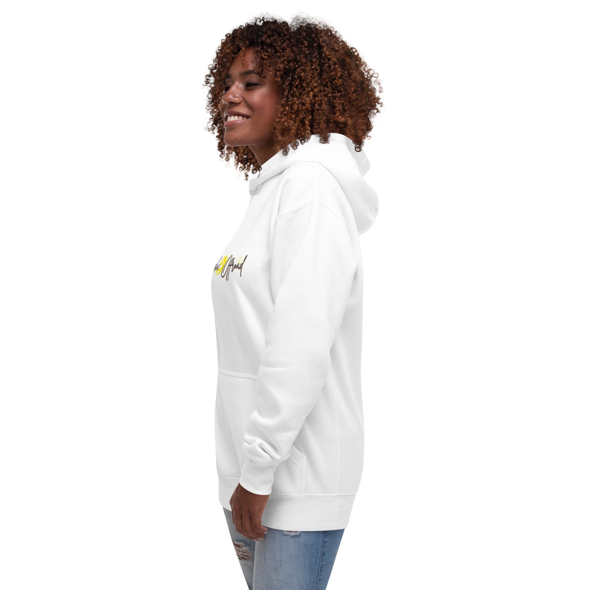 a woman wearing a white sweatshirt and jeans