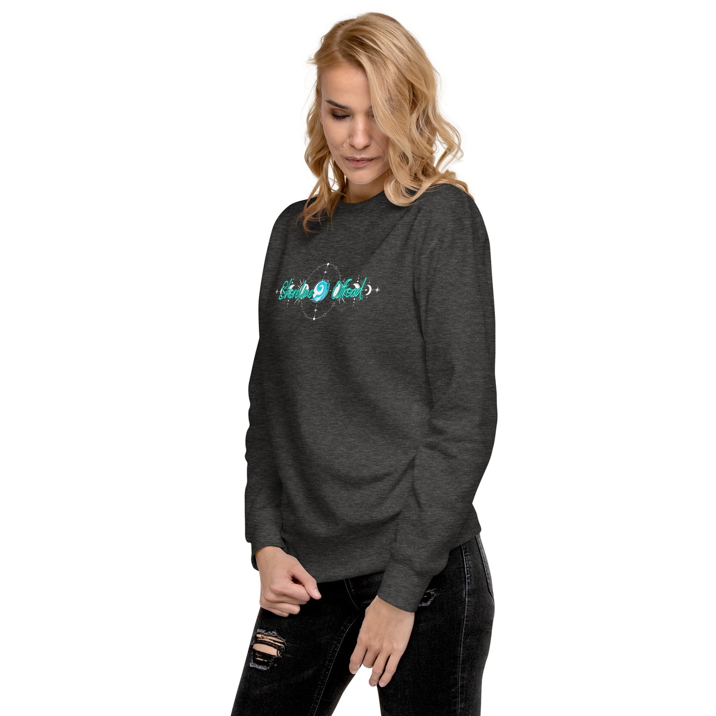 a woman wearing a black sweatshirt with a green logo on it