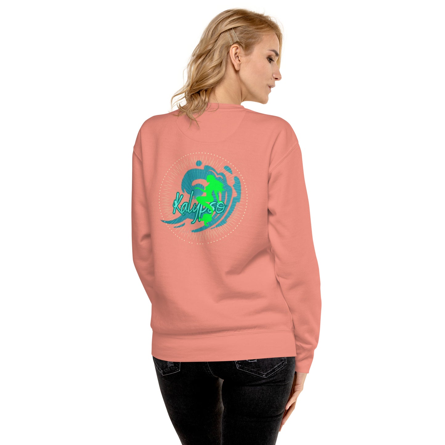 a woman wearing a pink sweatshirt with a green turtle on it