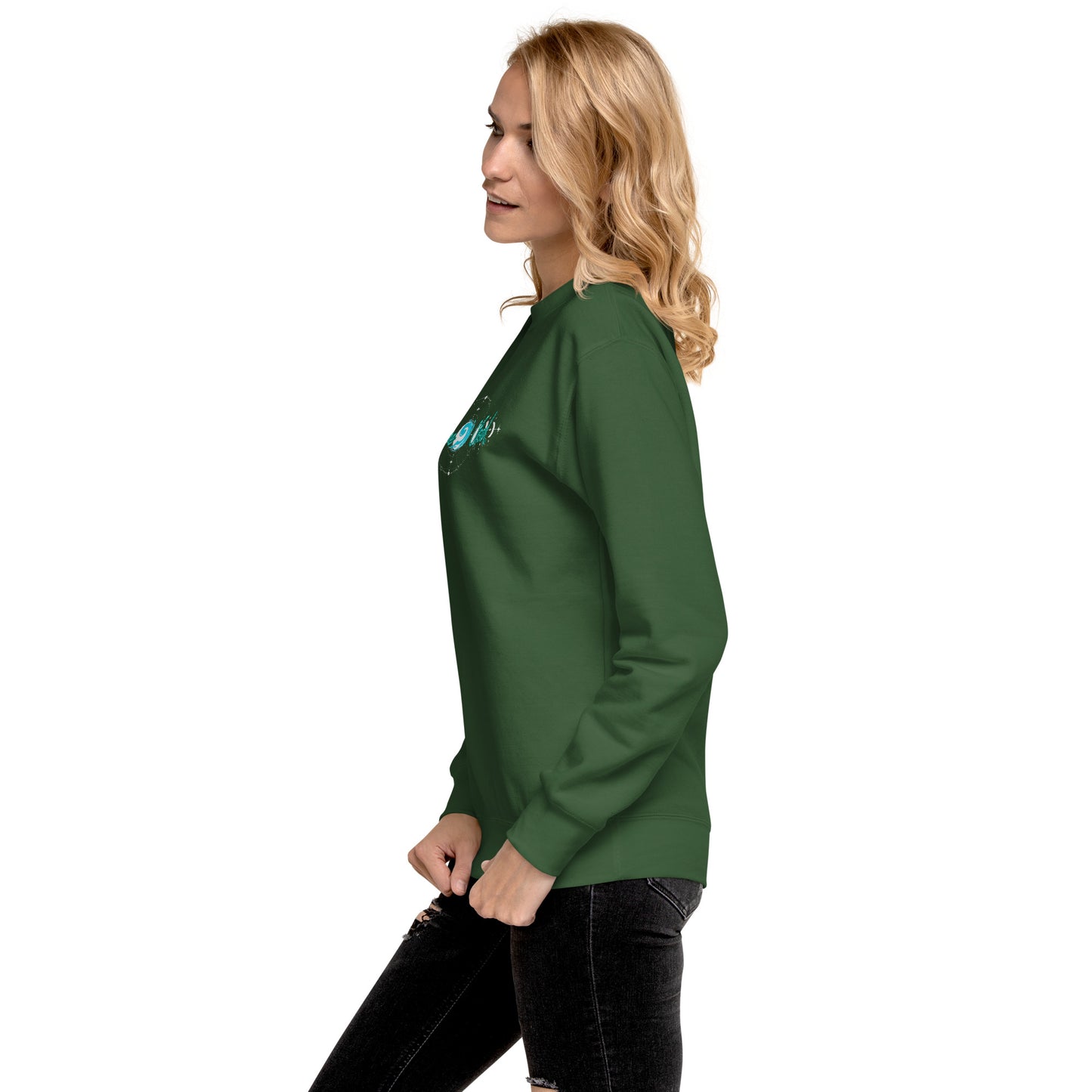 a woman wearing a green sweatshirt and black jeans