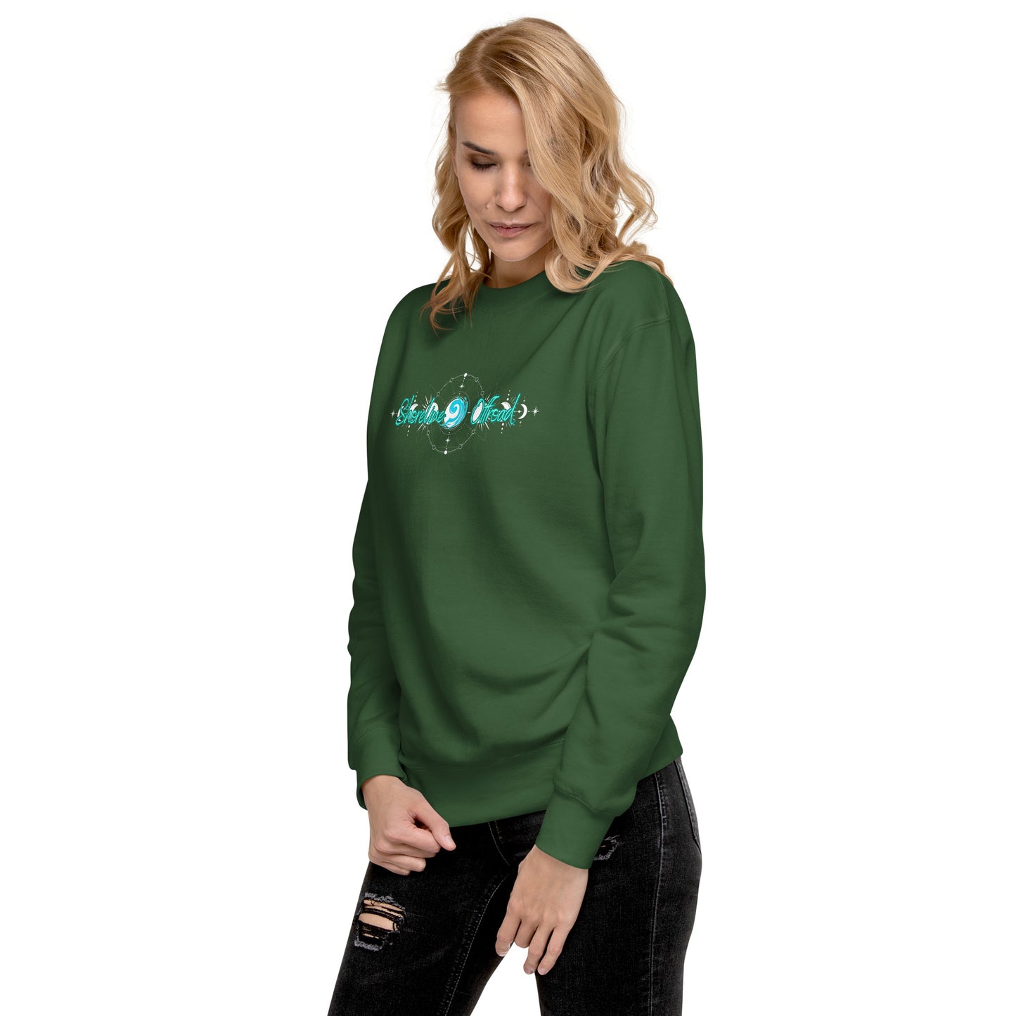 a woman wearing a green sweatshirt with a blue design on it