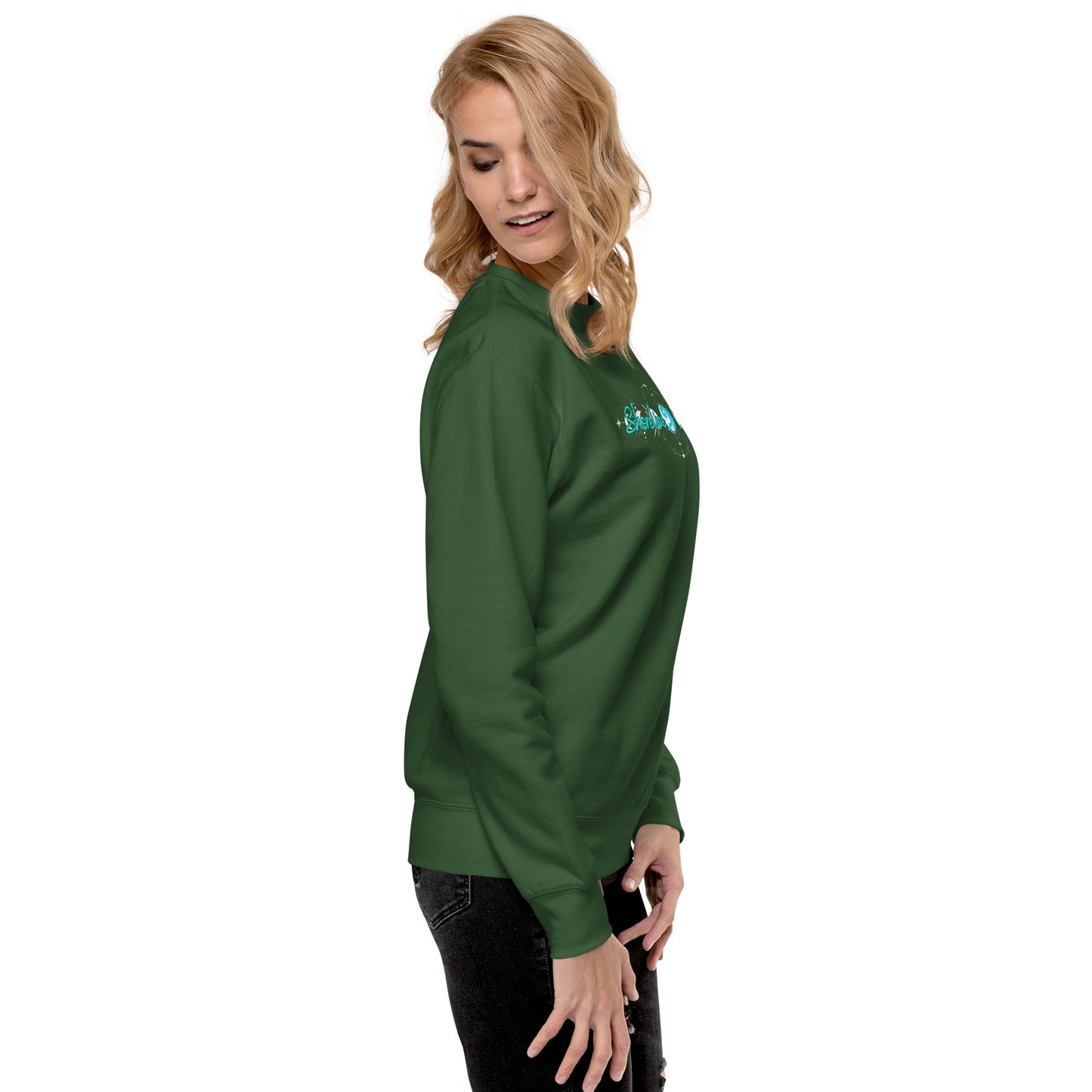 a woman wearing a green sweatshirt and black pants