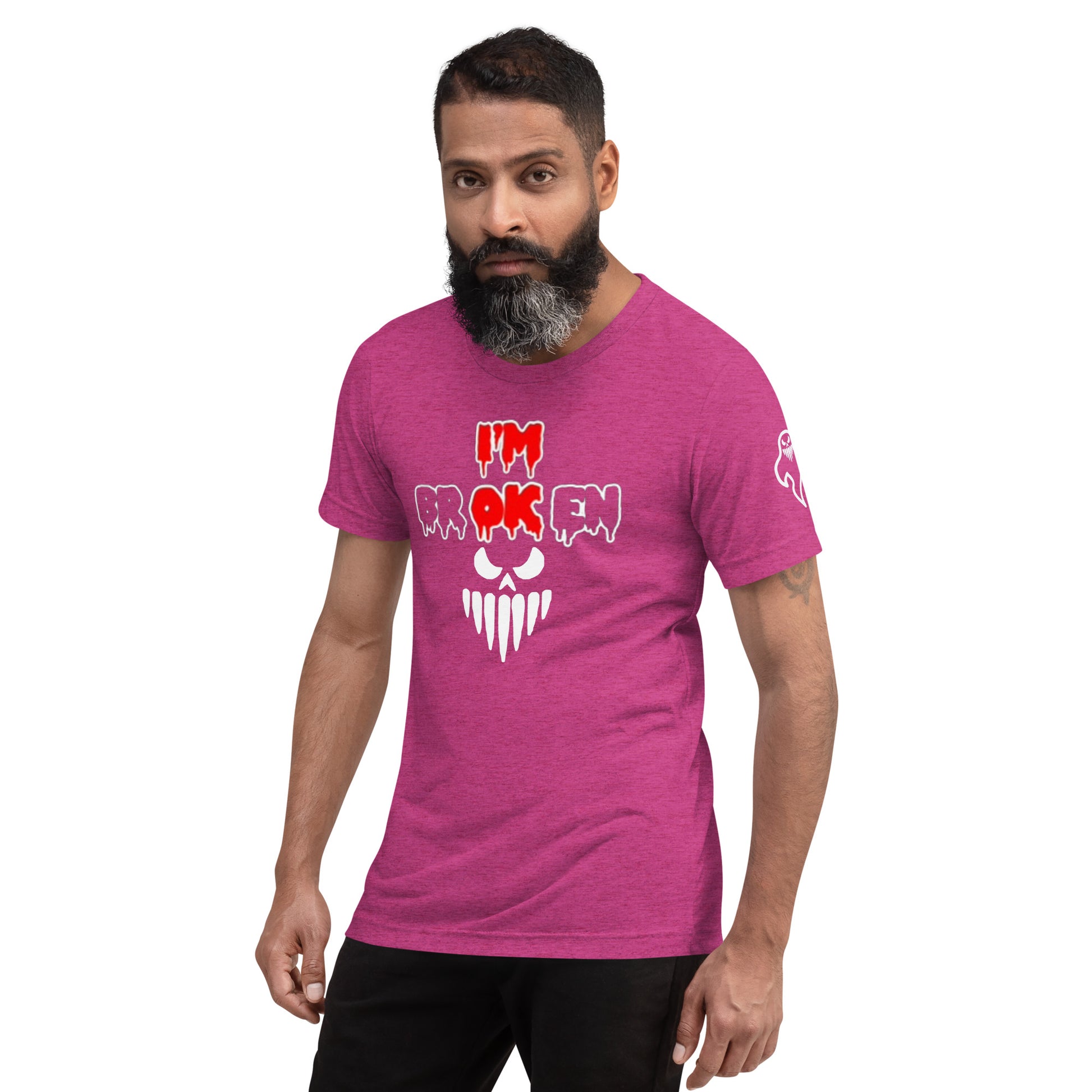 a man with a beard wearing a pink t - shirt